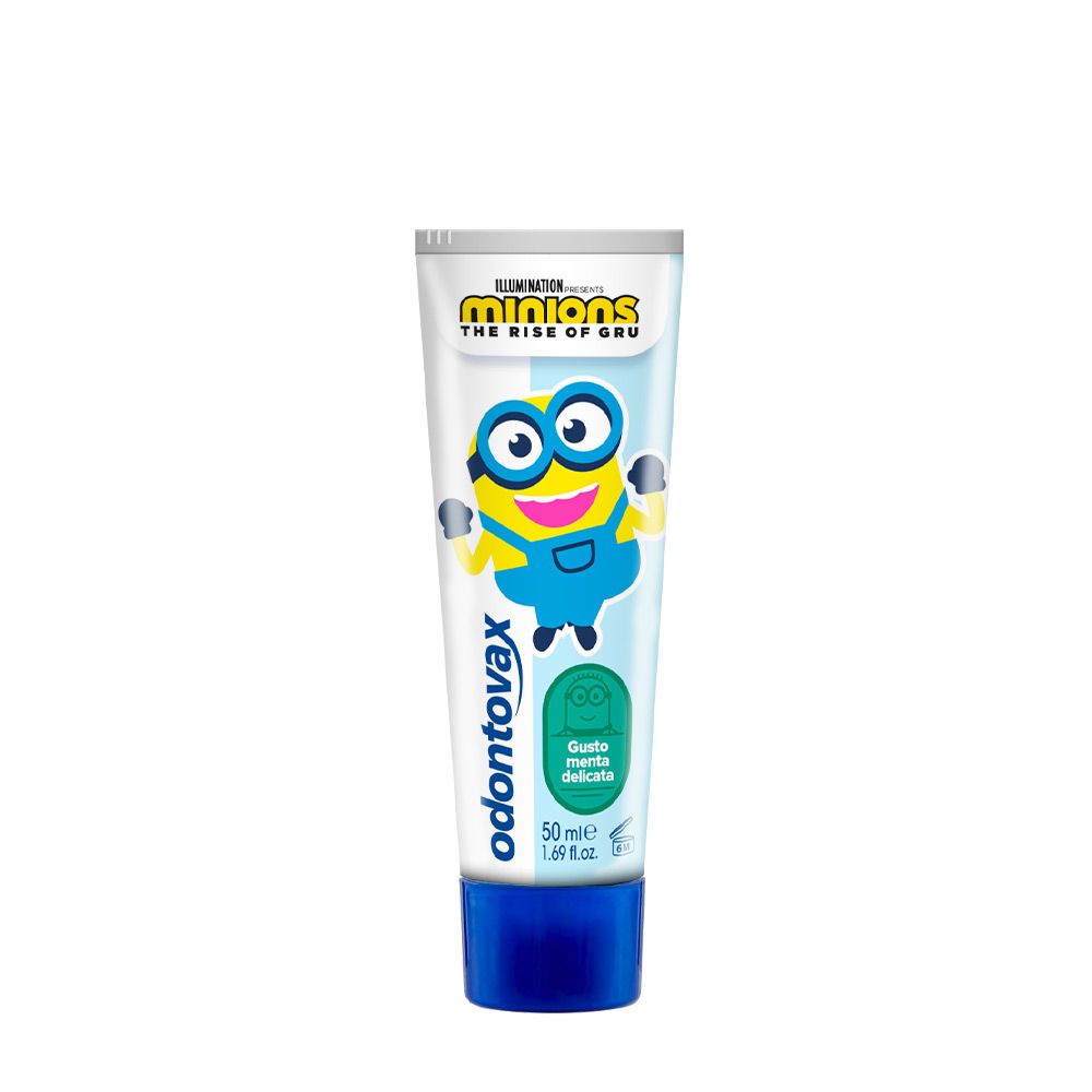 Tubo di dentifricio Odontovax Minions. Tappo blu, sfondo bianco. Scritta: Odontovax, Minions, gusto menta.