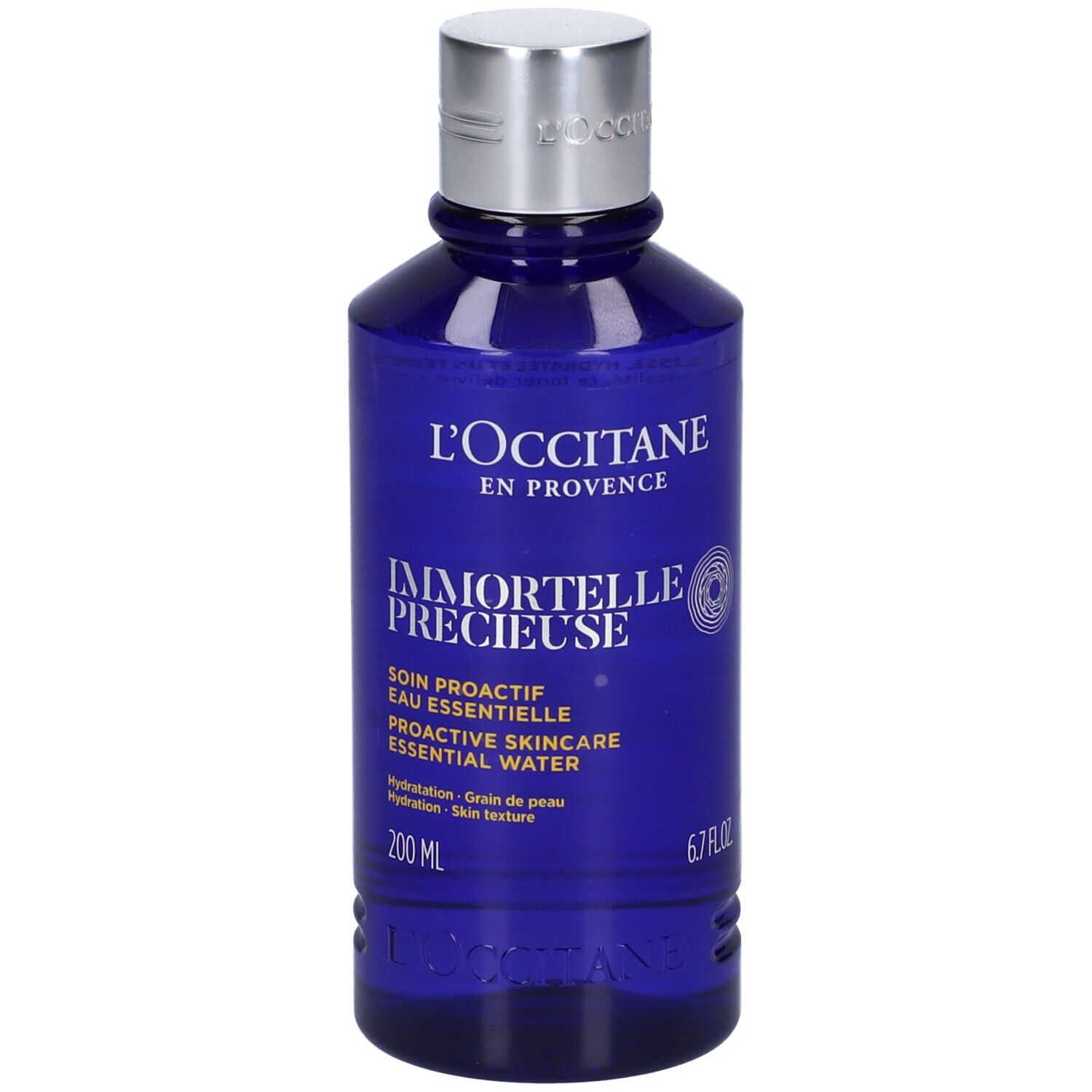 Blaue Flasche mit silbernem Deckel. Aufschrift: L'Occitane, Immortelle Précieuse, 200 ml, 6.7 FL.OZ.