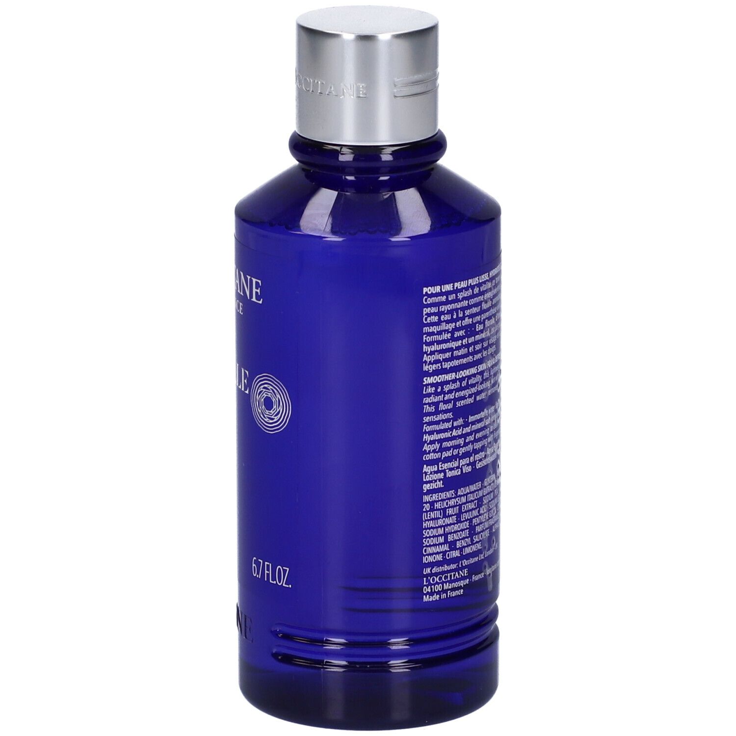 Blaue Flasche mit silbernem Deckel. Rückseite mit Text und 6.7 FL.OZ. Aufschrift: L'Occitane.