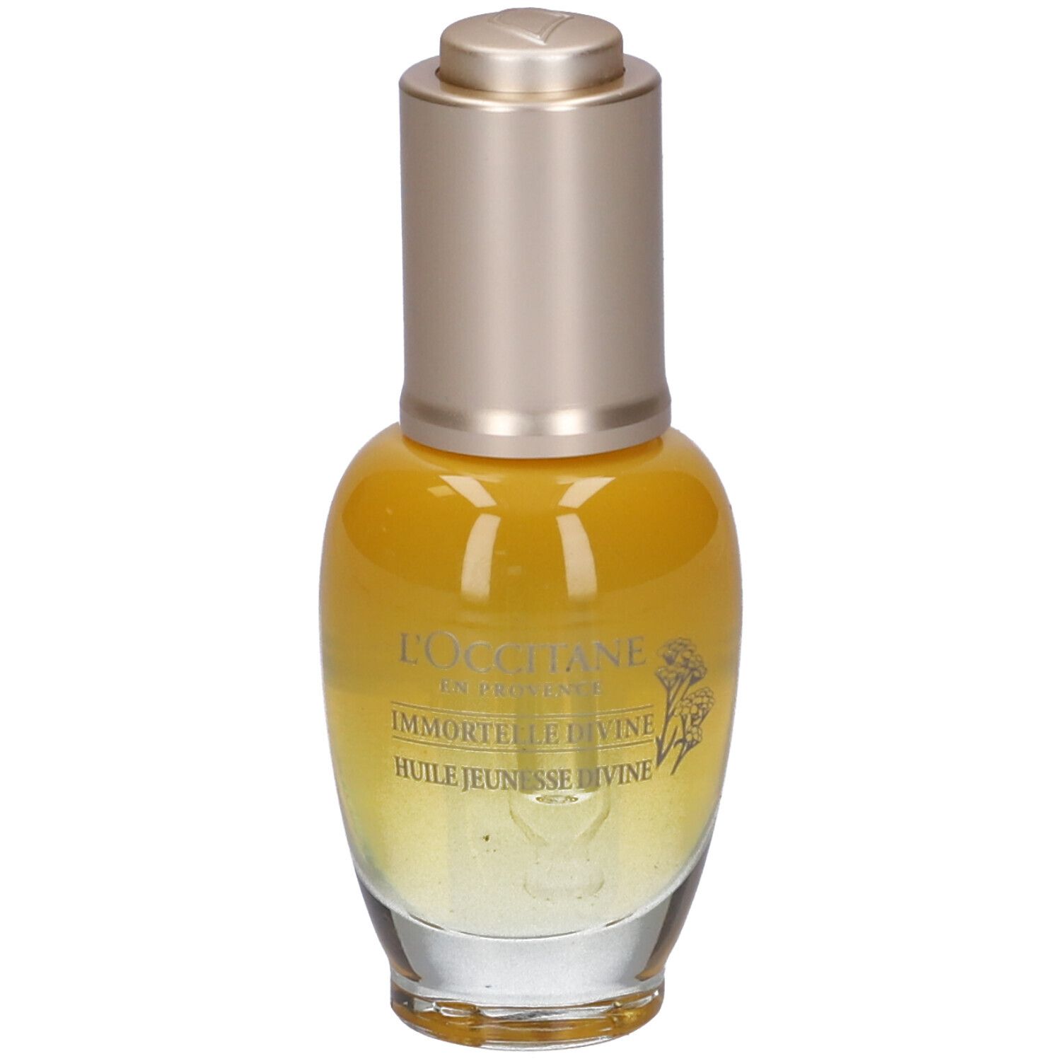 Flacone giallo trasparente, tappo dorato. Scritte: Immortelle Divine, Huile Jeunesse Divine.