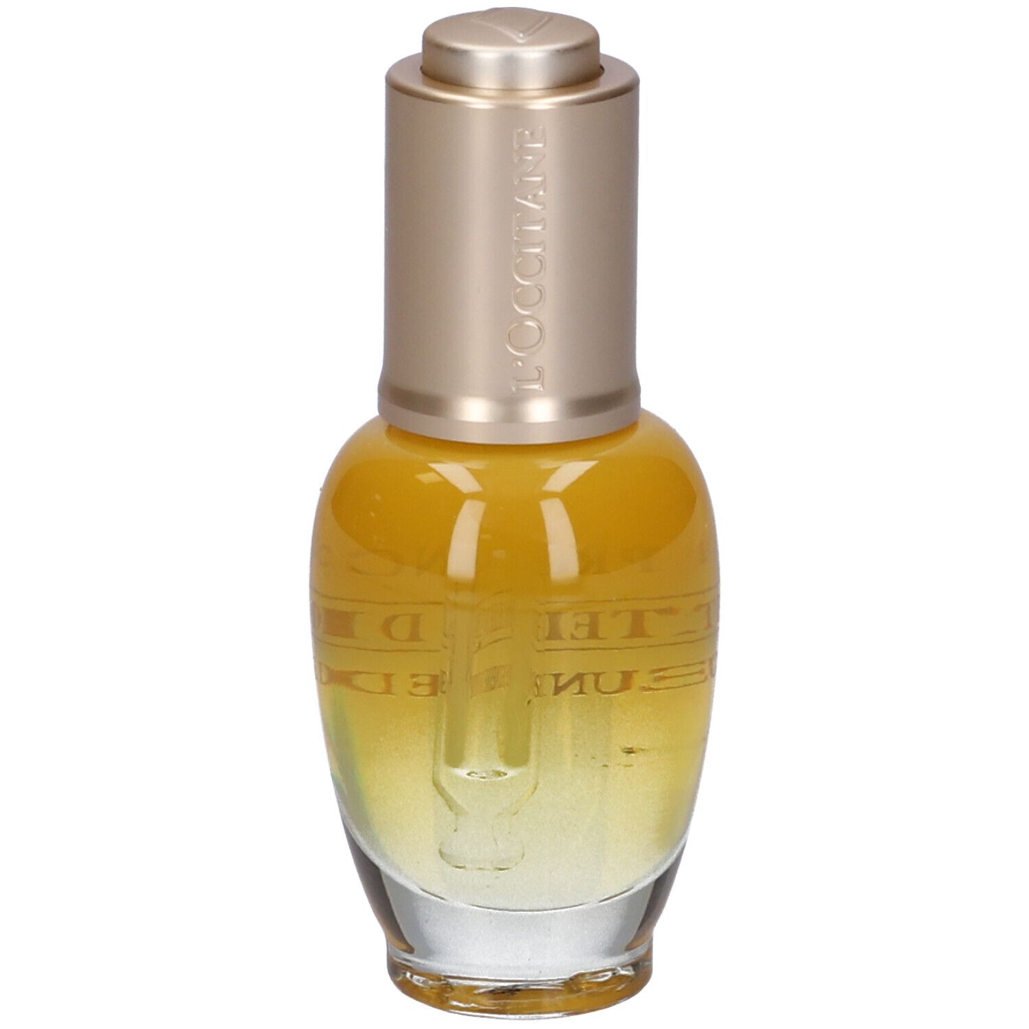 Flacone giallo trasparente, tappo dorato e pipetta. Scritte: L'Occitane, Immortelle Divine, Huile Jeunesse Divine.