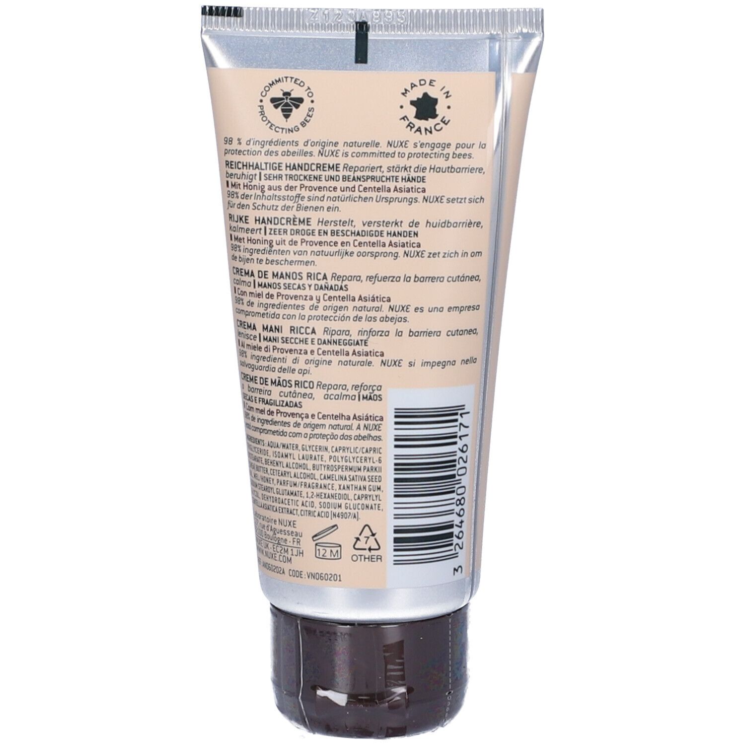 Retro di un tubo di crema. Testo multilingue. Sfondo beige. Prodotto in Francia.