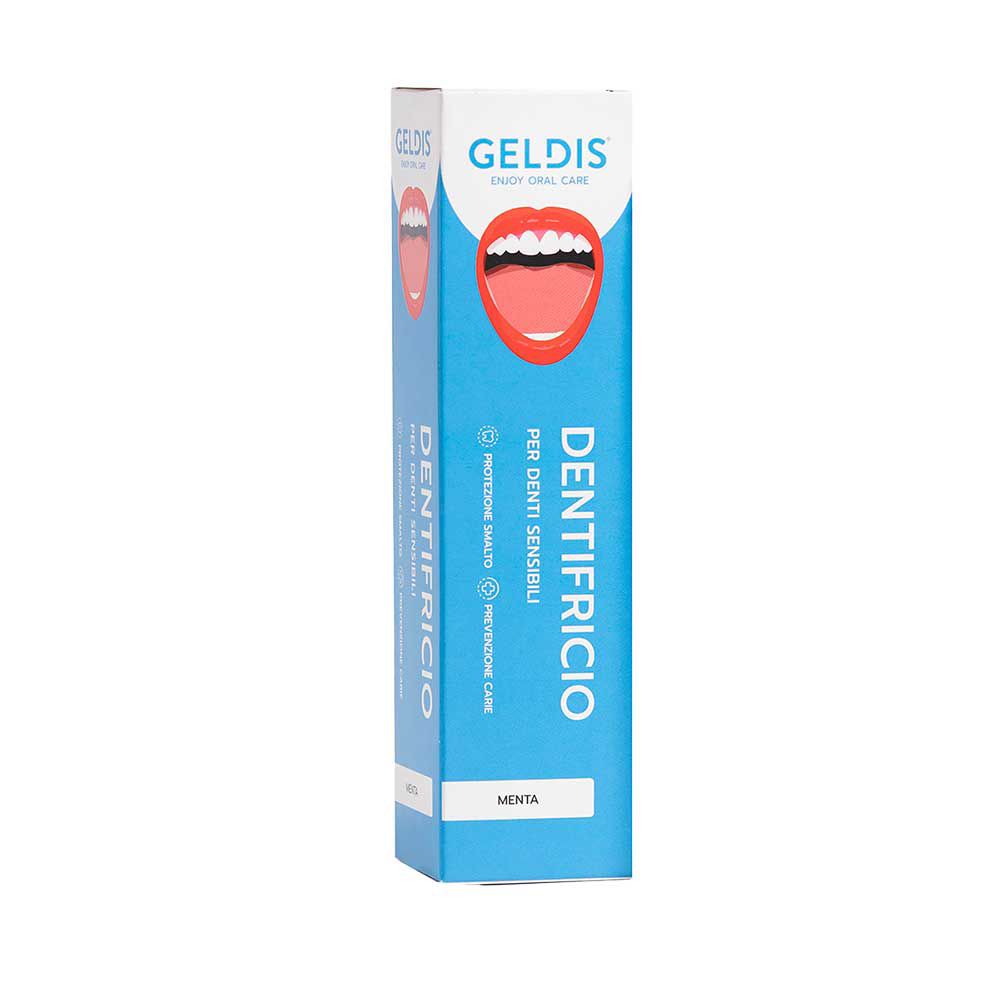 Blaue Schachtel mit Zahncreme. Geldis-Logo, Produktname und Mund-Abbildung. Text: Per denti sensibili.