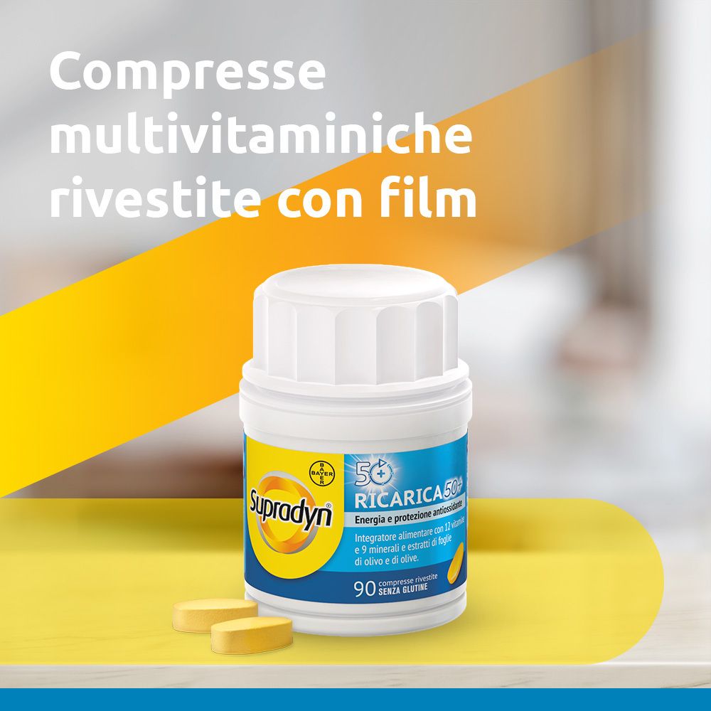 Flacone bianco con compresse gialle. Testo: Compresse multivitaminiche rivestite con film.