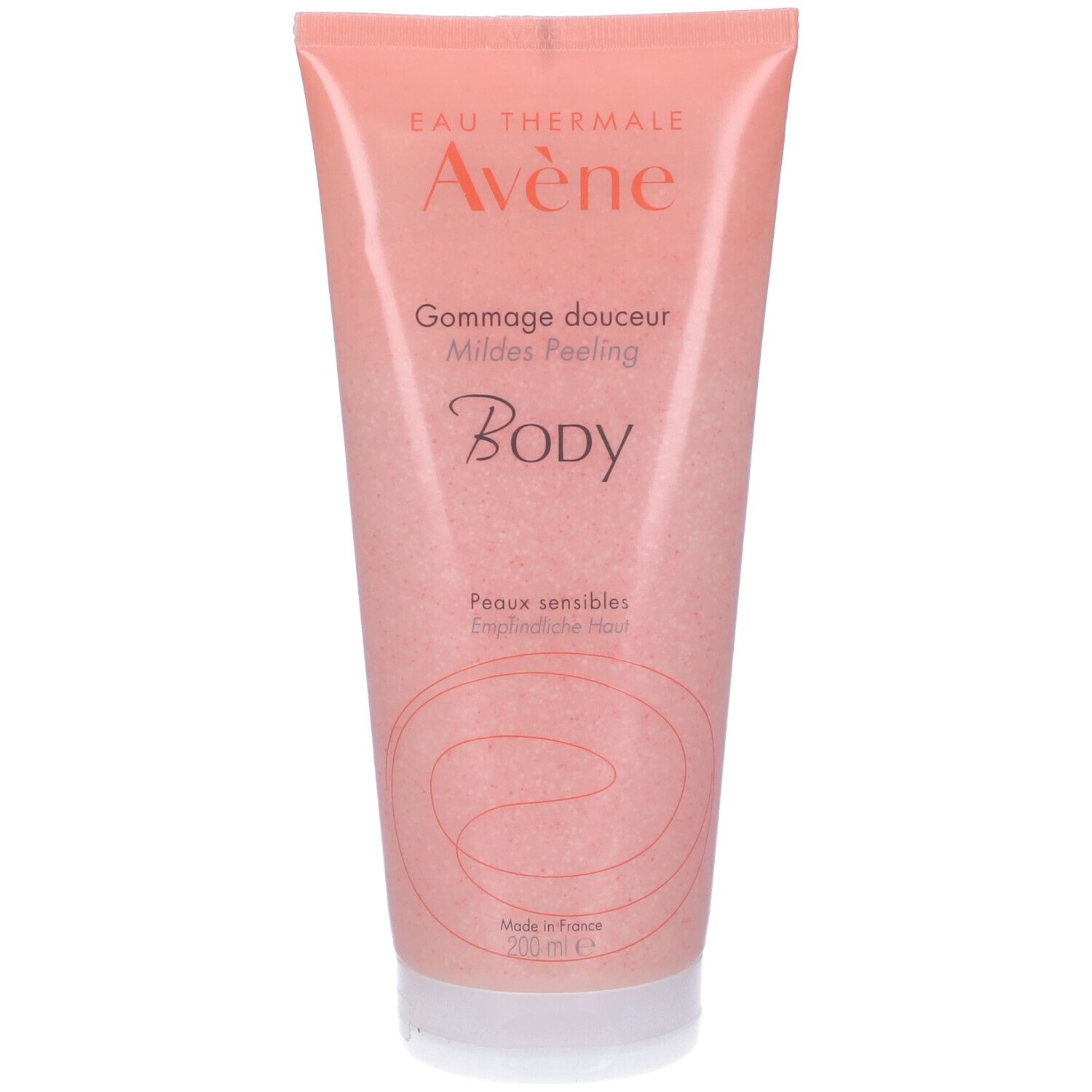 Tubo rosa con tappo bianco. Scritta: Eau Thermale Avène, Gommage douceur, Milde Peeling, Body.