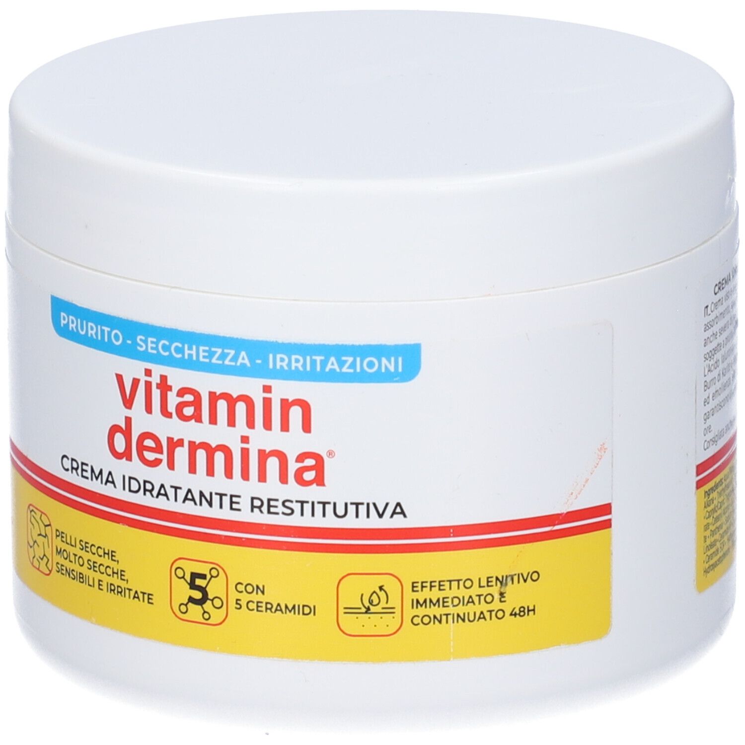 Vaso bianco di crema Vitamin Dermina. Scritta: Crema idratante restitutiva. Accenti gialli e blu.
