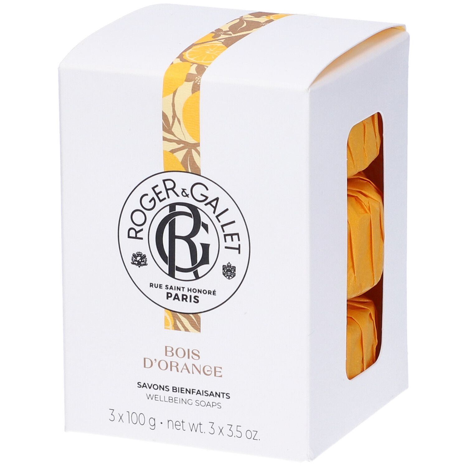 Scatola bianca con tre saponi arancioni. Logo e nome del prodotto. Nastro giallo decorativo.