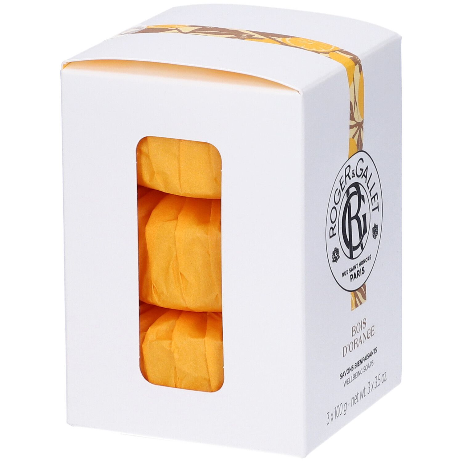 Scatola bianca con tre saponi arancioni. Logo e nome del prodotto. Nastro giallo decorativo.