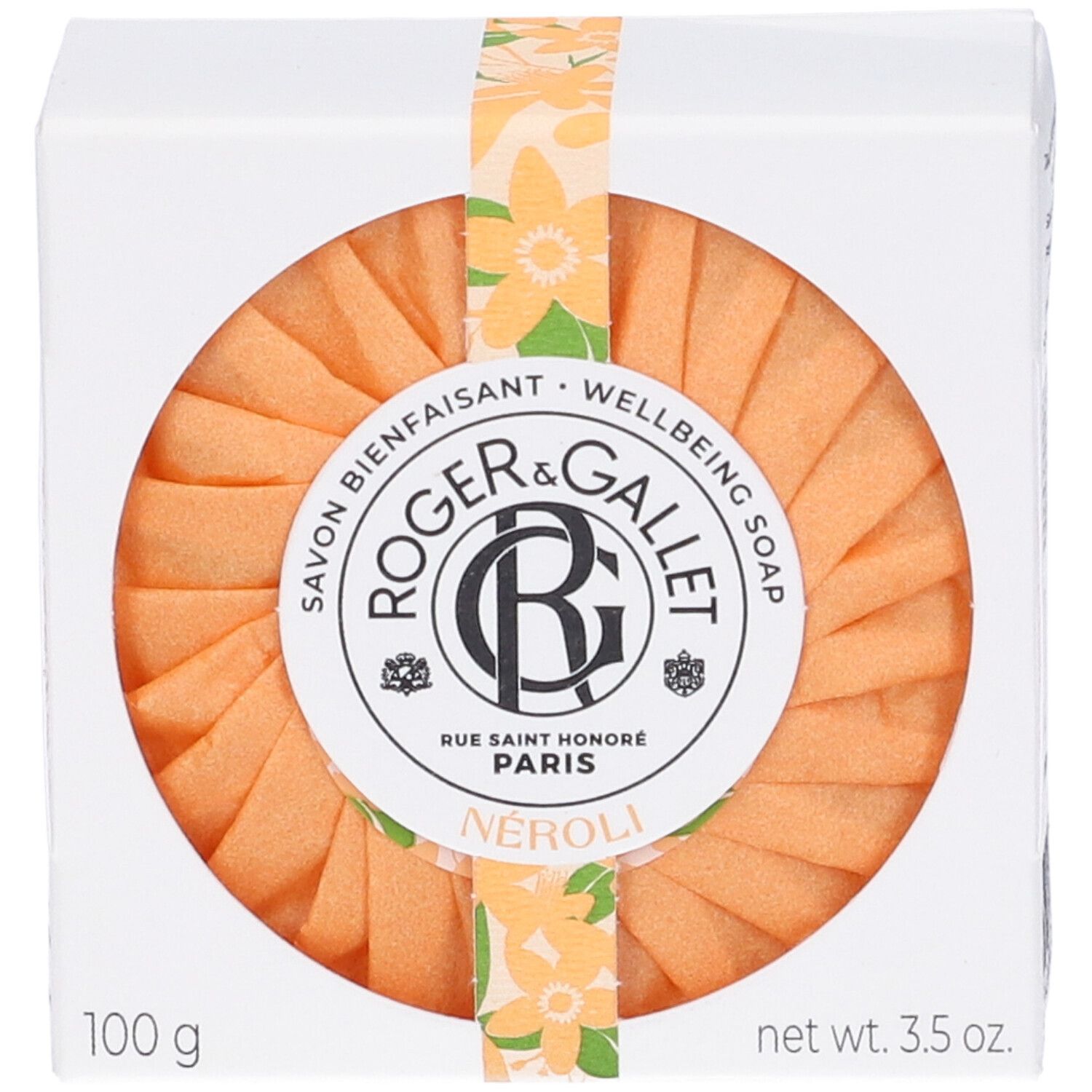 Saponetta arancione rotonda in scatola bianca. Marchio: Roger&Gallet. Testo: Neroli, 100 g, 3.5 oz.