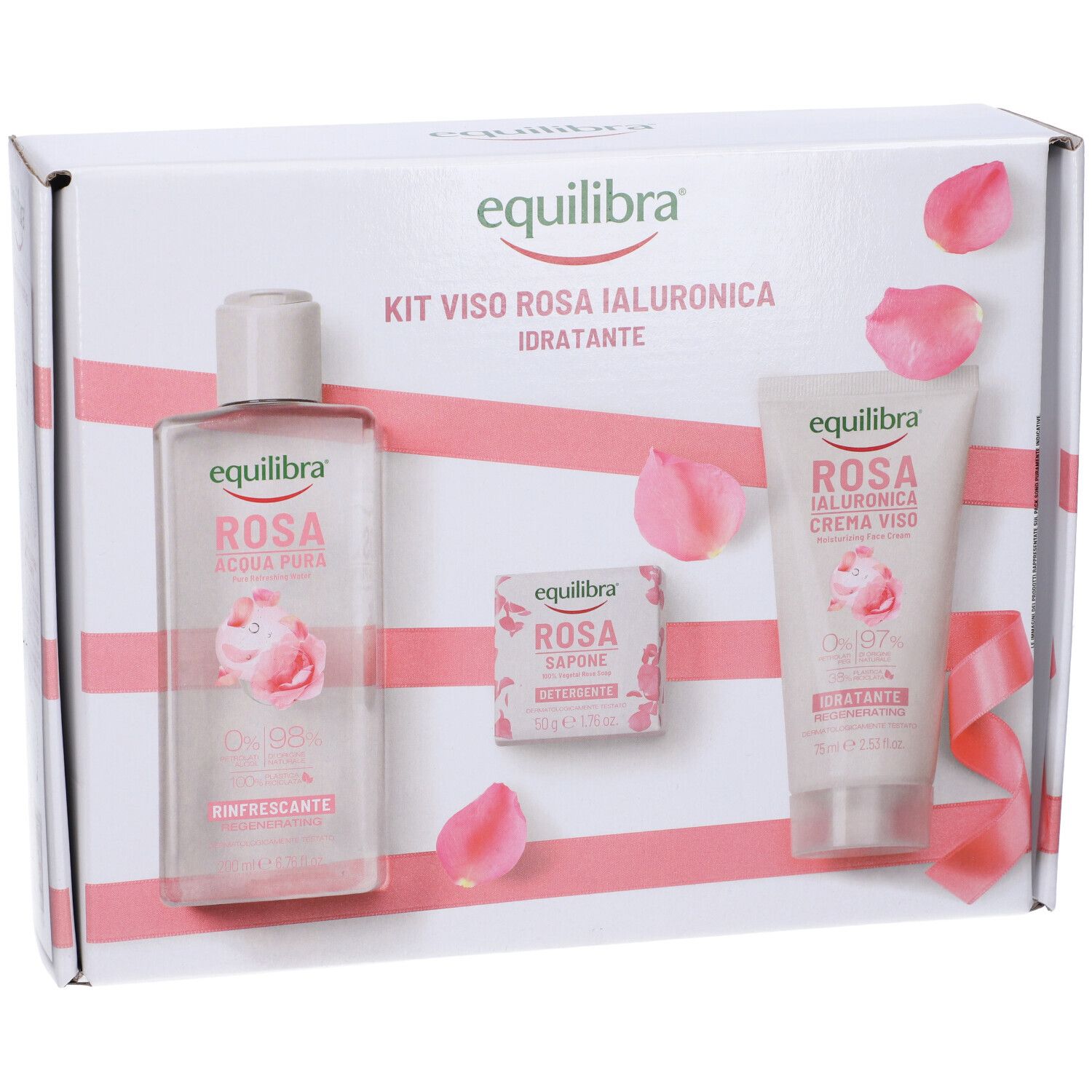 Kit regalo con lozione, sapone e crema. Petali di rosa decorano la confezione.