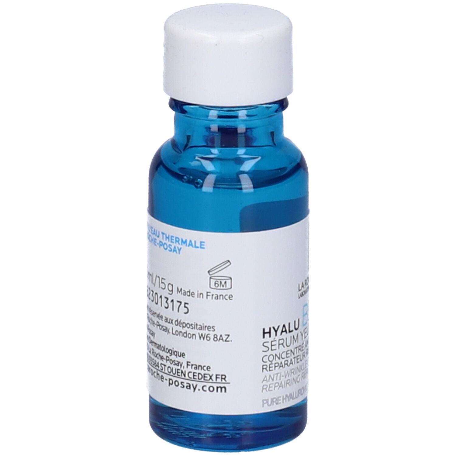 Flacone di vetro blu con tappo bianco. Etichetta con informazioni sul prodotto. Testo: Hyalu B5 Serum Yeux/Eye.