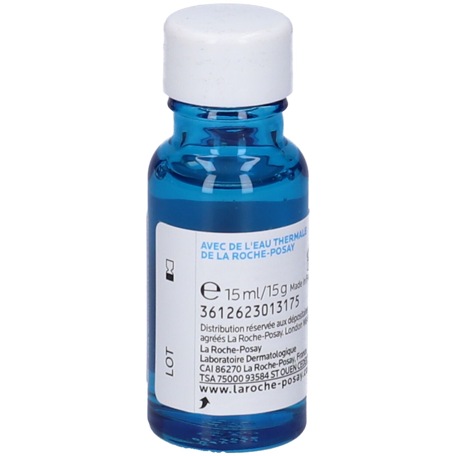 Flacone di vetro blu con tappo bianco. Etichetta con informazioni sul prodotto. Testo: 15 ml/15 g. Fatto in Francia.