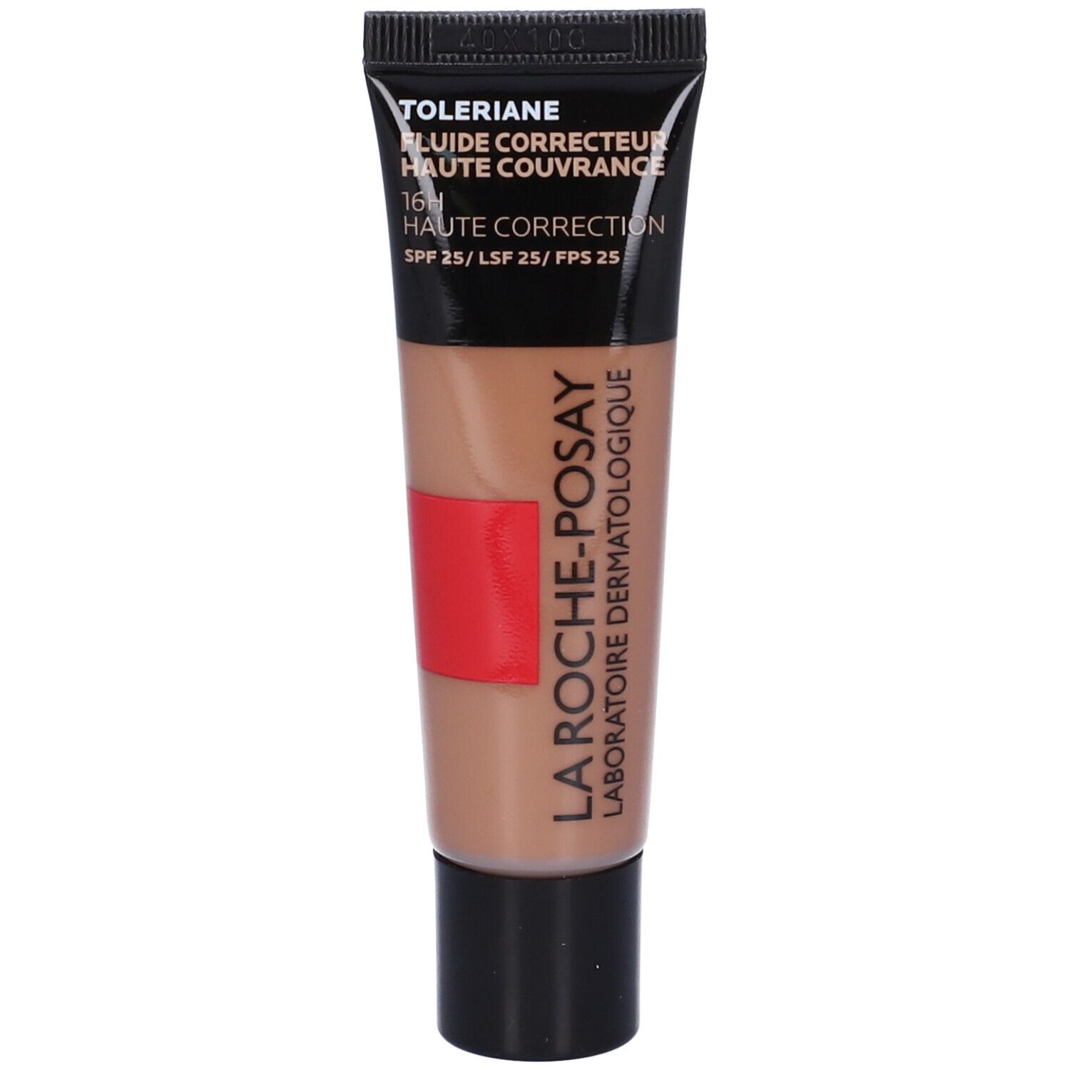 Tubo di fondotinta. Tappo nero, corpo beige con striscia rossa. Scritta: Toleriane, Haute Couvrance, SPF 25.