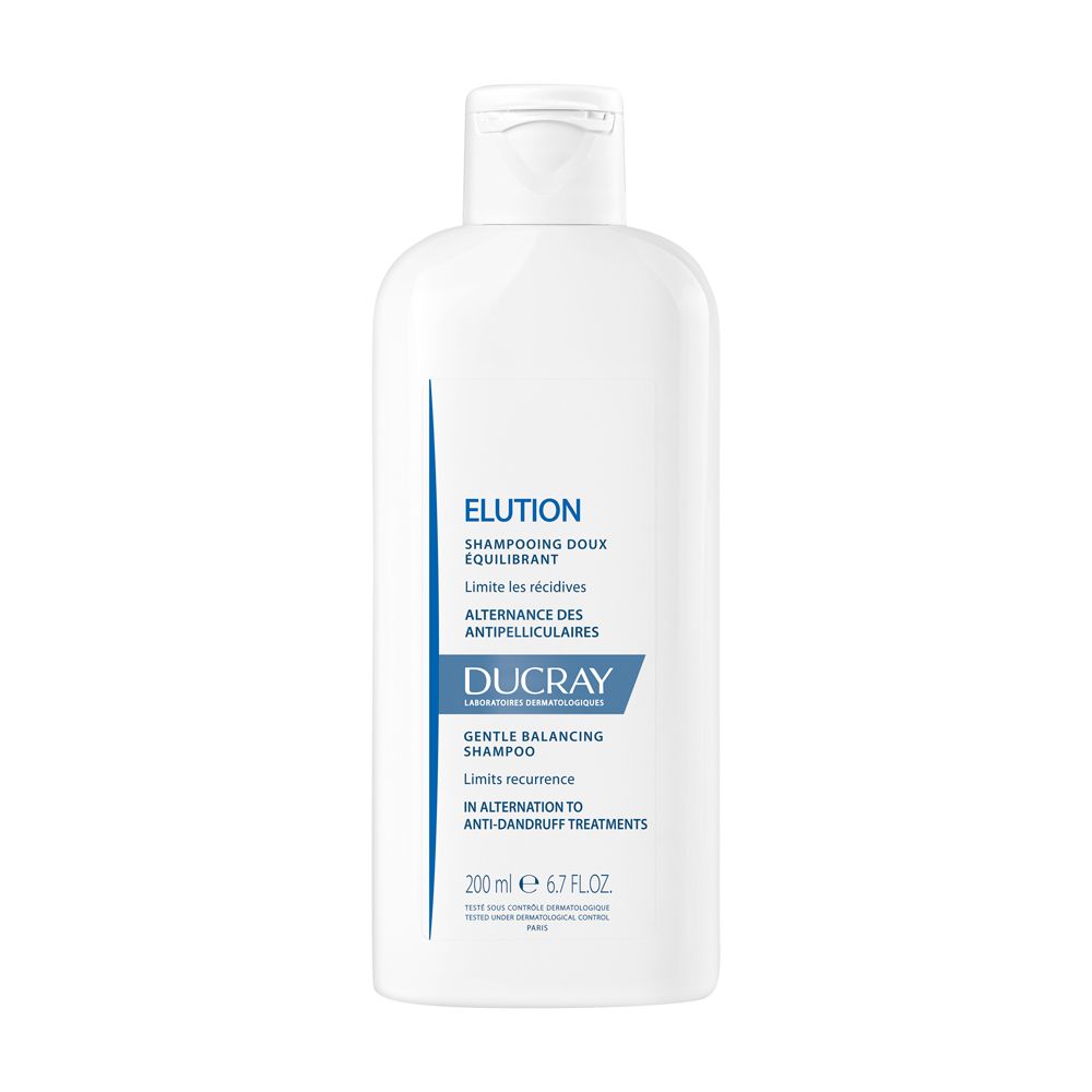 Flacone bianco con etichetta blu. Scritta: Elution, Shampooing doux équilibrant, Ducray. 200 ml.