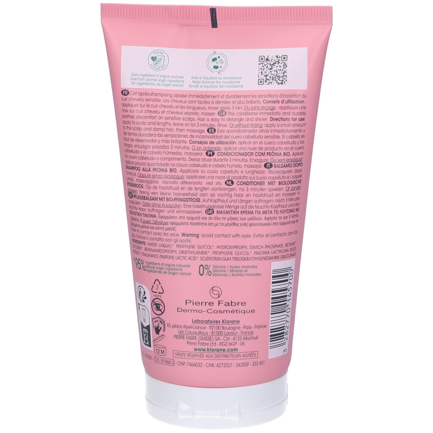 Retro del tubo rosa Klorane. Testo, ingredienti, informazioni del produttore e simboli di riciclaggio. Prodotto in Francia.