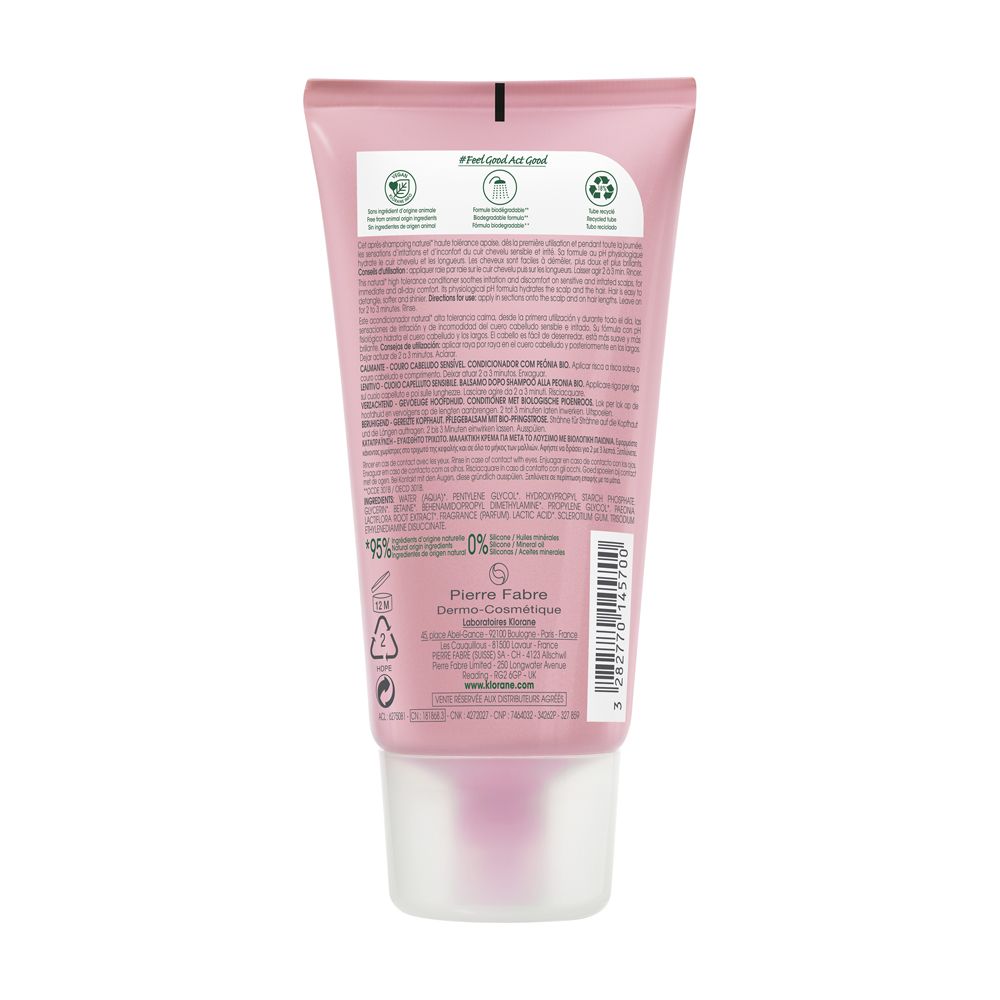 Retro del tubo rosa Klorane. Testo, ingredienti, informazioni del produttore e simboli di riciclaggio. Prodotto in Francia.