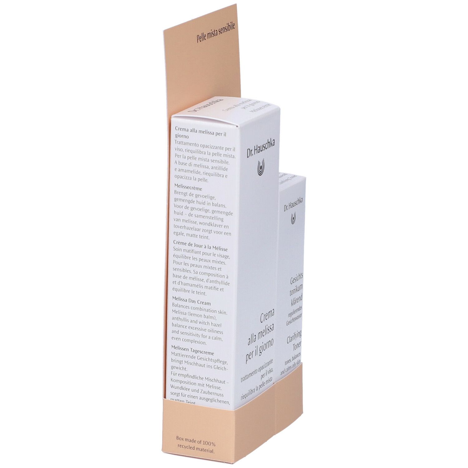 Due prodotti Dr. Hauschka in confezione bianca. Espositore con testo. Lato con informazioni e ingredienti del prodotto.