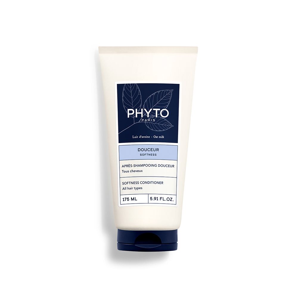 Tubo di crema bianca con etichetta blu. Testo: "PHYTO PARIS", "DOUCEUR", "Softness Conditioner".