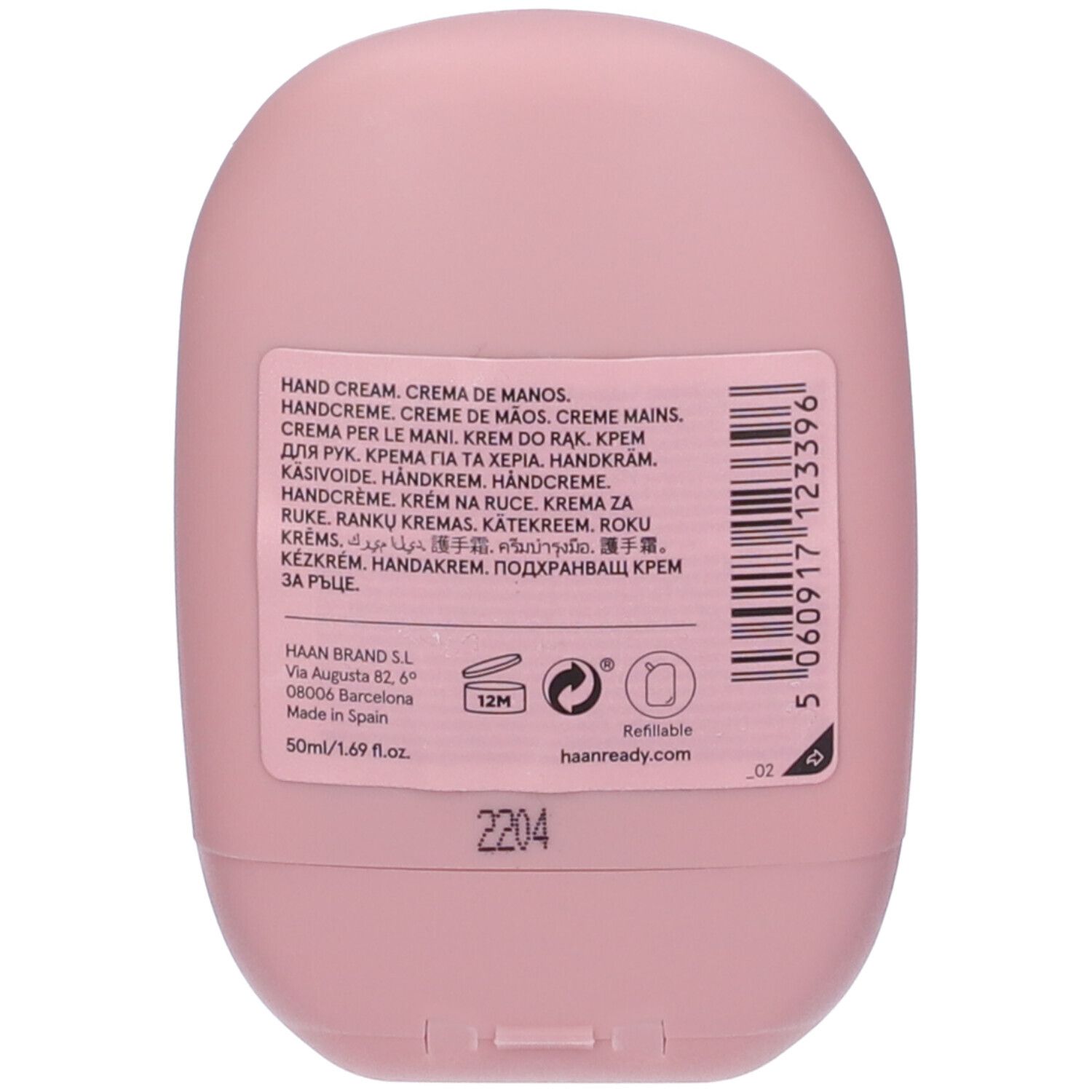 Retro del tubo di crema mani rosa. Informazioni multilingue sul prodotto. Contiene 50ml/1.69 fl.oz. Ricaricabile.