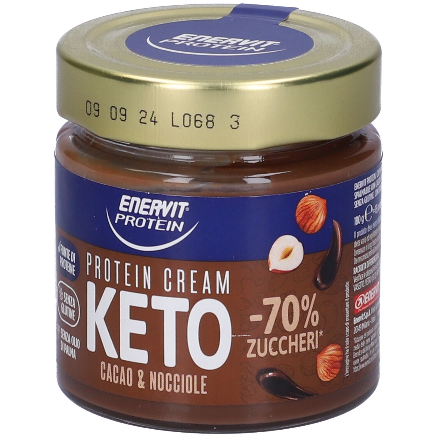 Glas mit Keto-Protein-Creme. Aufschrift: Enervit Protein, Keto, Cacao & Nocciole, -70% Zucker. Mit Haselnuss- und Kakaobohnen-Illustrationen. Datumsstempel.