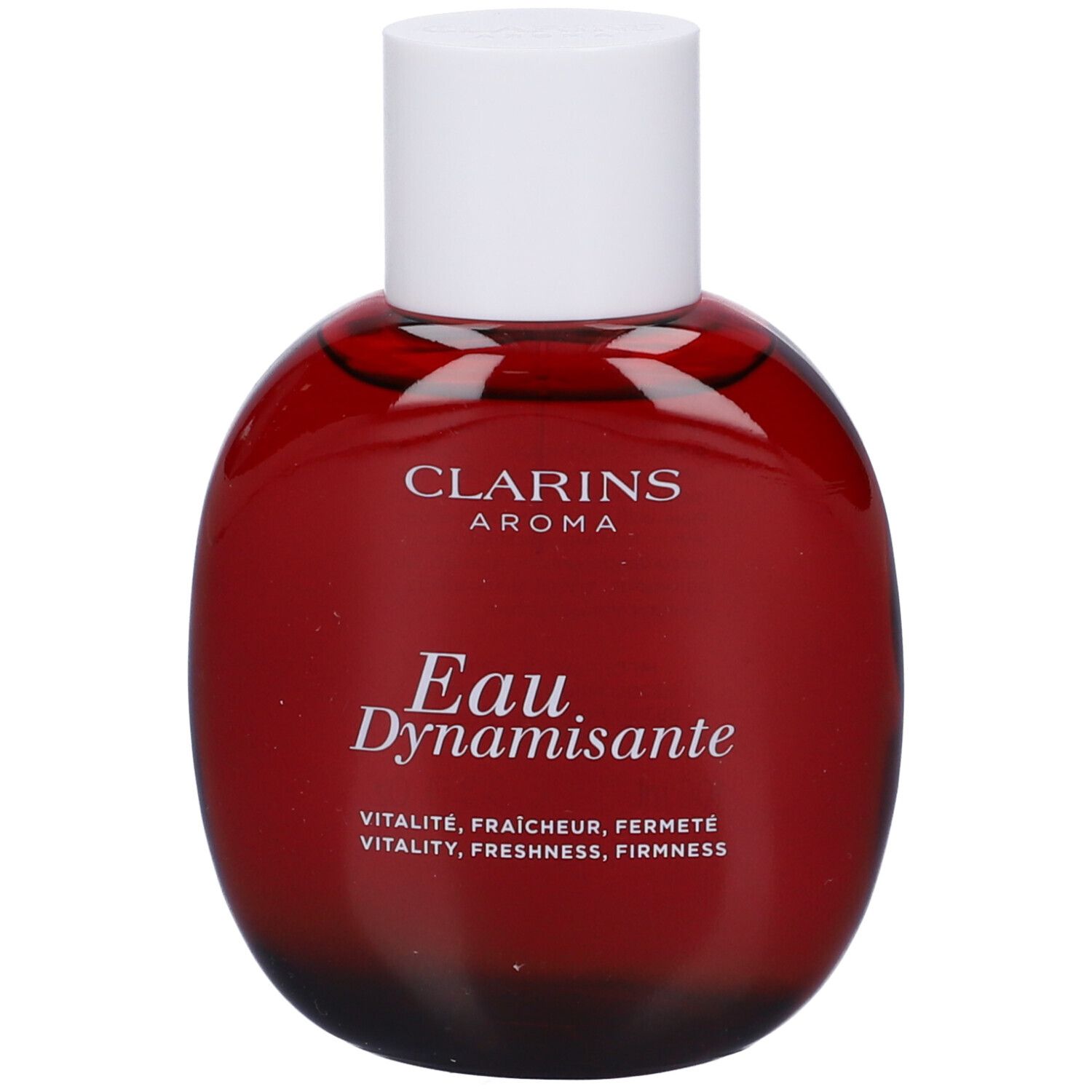 Flacone rotondo rosso con tappo bianco. Scritta: Clarins Aroma, Eau Dynamisante. Scritta inglese: Vitality, Freshness, Firmness.