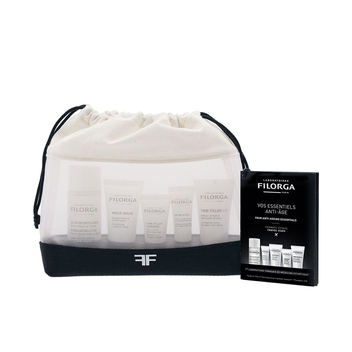Filorga Discovery Kit. Include formati da viaggio in una borsa a rete bianca con base nera. Scatola nera con nome del prodotto.