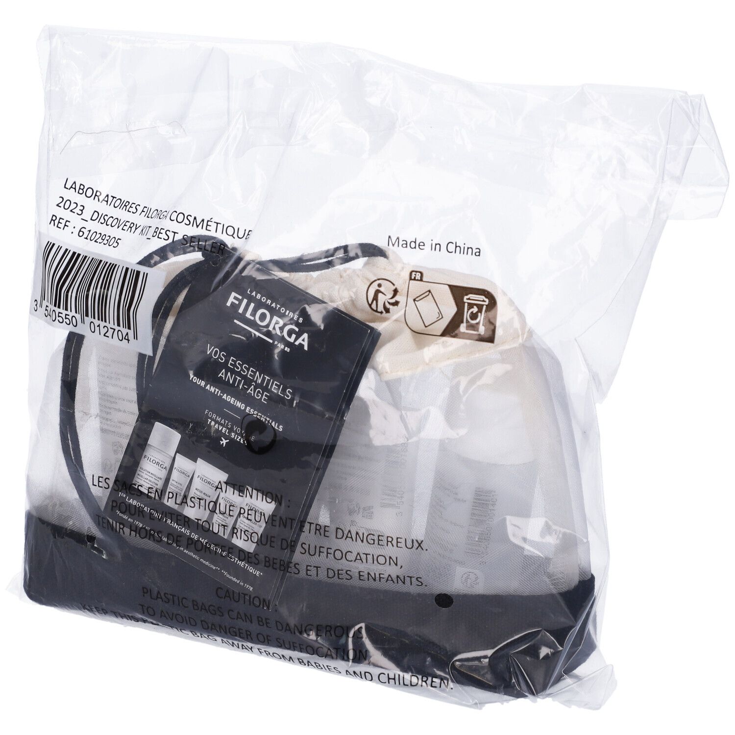 Filorga Discovery Kit in confezione di plastica. Borsa nera con prodotti. Etichette e nomi visibili.