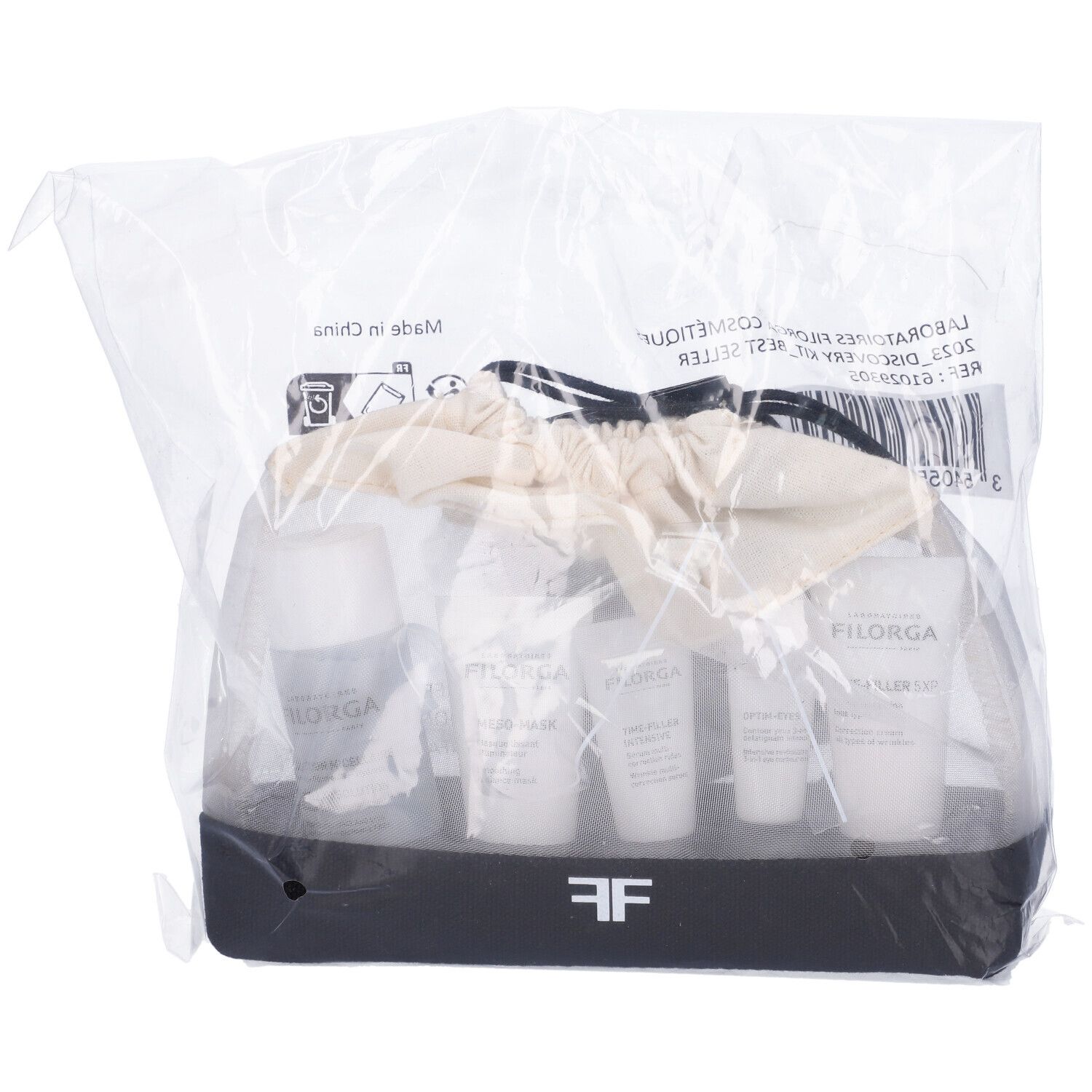 Filorga Discovery Kit in confezione di plastica. Prodotti in una borsa bianca e nera. Etichette visibili.