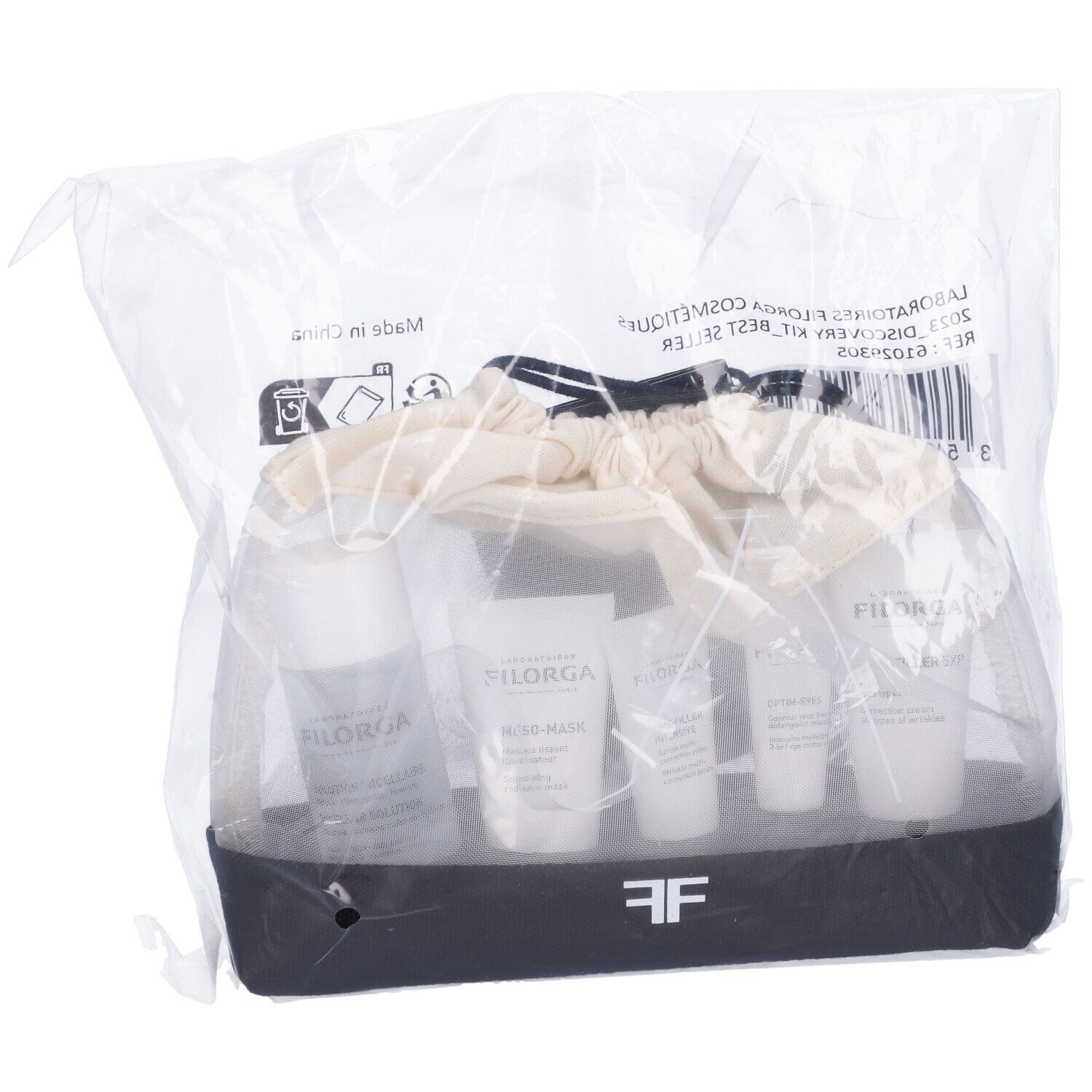 Filorga Discovery Kit in confezione di plastica. Prodotti in una borsa bianca e nera. Etichette visibili.