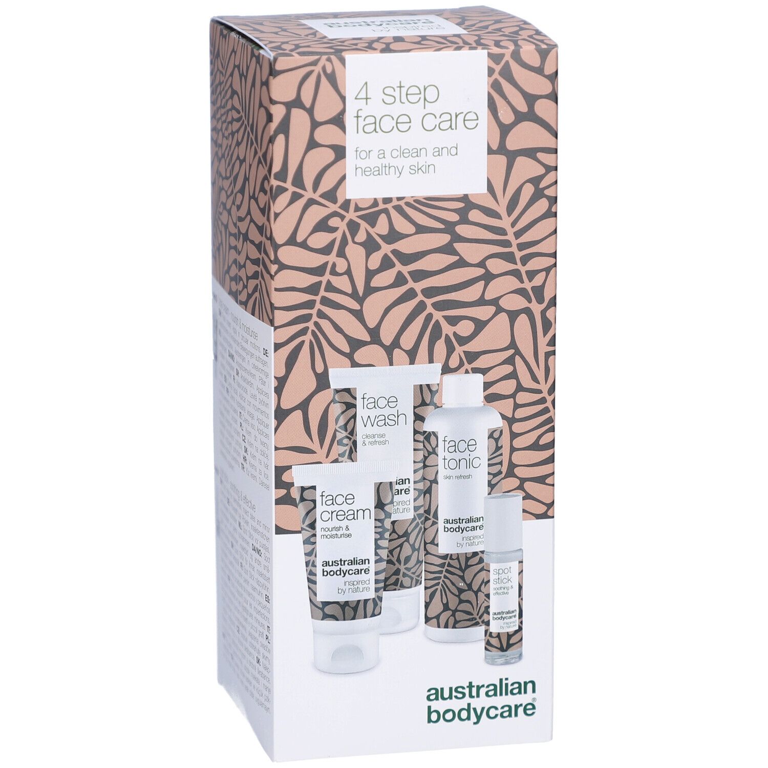 Kartonverpackung mit vier Gesichtspflegeprodukten. Produkte: Face Wash, Face Tonic, Face Cream, Spot Stick. Hintergrundmuster.