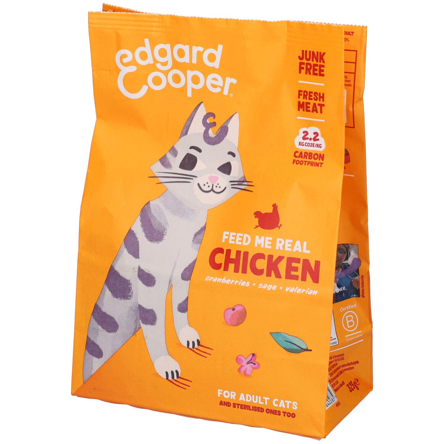 Confezione arancione con immagine di gatto e nome del prodotto. Testo: "Feed me real Chicken".