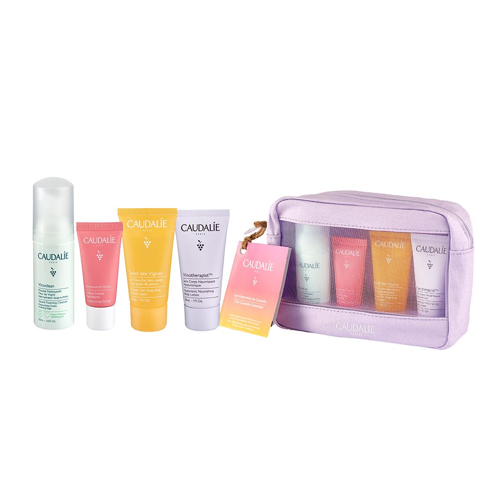 Pochette cosmetica lilla con inserto trasparente e diversi tubetti. Un'etichetta con logo.