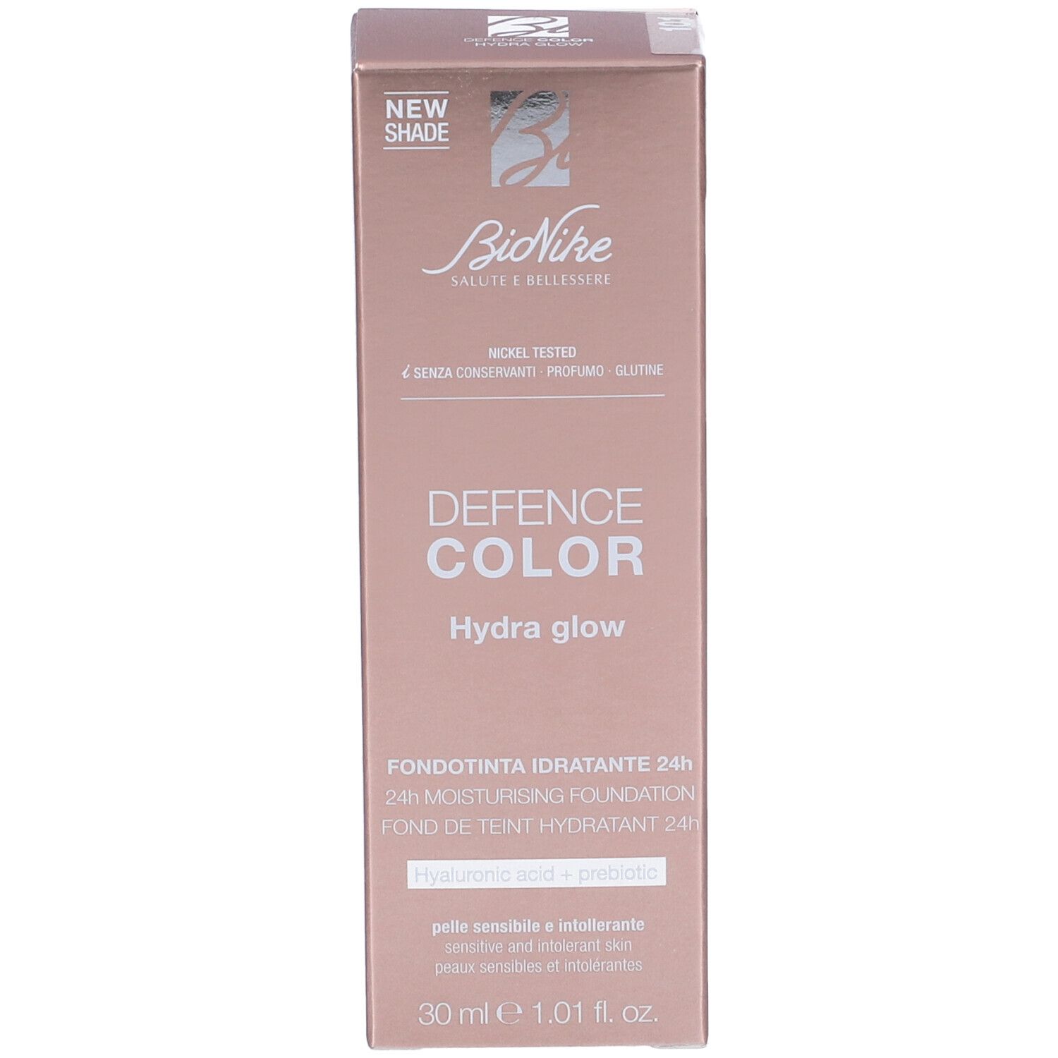 Scatola BioNike Defence Color Hydra Glow Fondotinta Idratante 24h. Informazioni prodotto e logo su sfondo rosa.