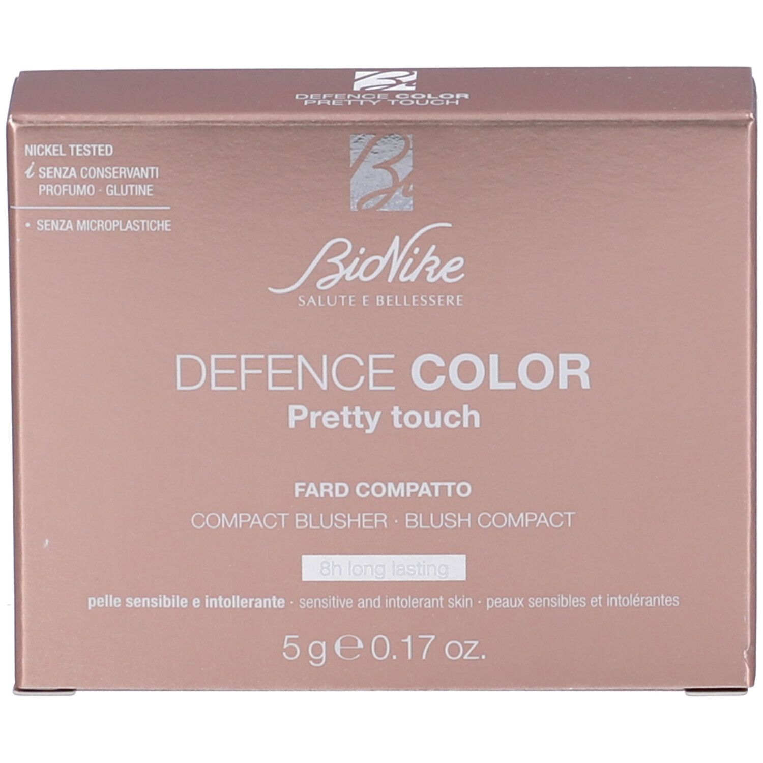 Confezione cosmetica. Scatola rosa e marrone, nome del prodotto e marchio visibili. Contiene fard.