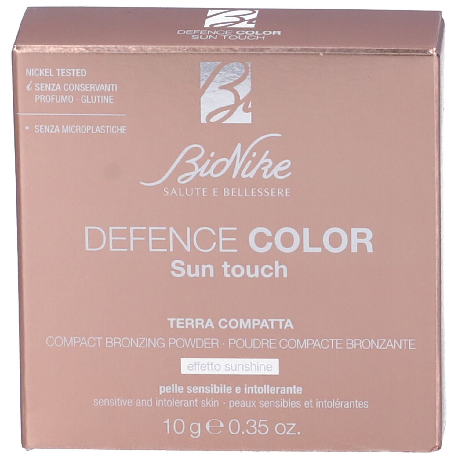 Confezione rosa con nome del prodotto e logo. Testo: Defence Color Sun touch Terra Compatta.