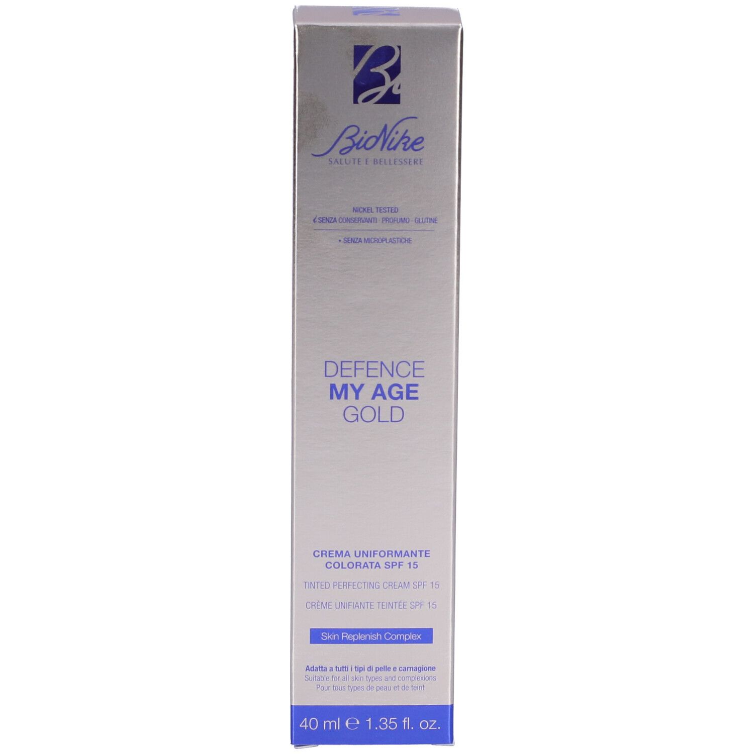 Schachtel mit Aufschrift: Bionike, Defence My Age Gold, Crema Uniformante Colorata SPF15. Silberne und blaue Farben.