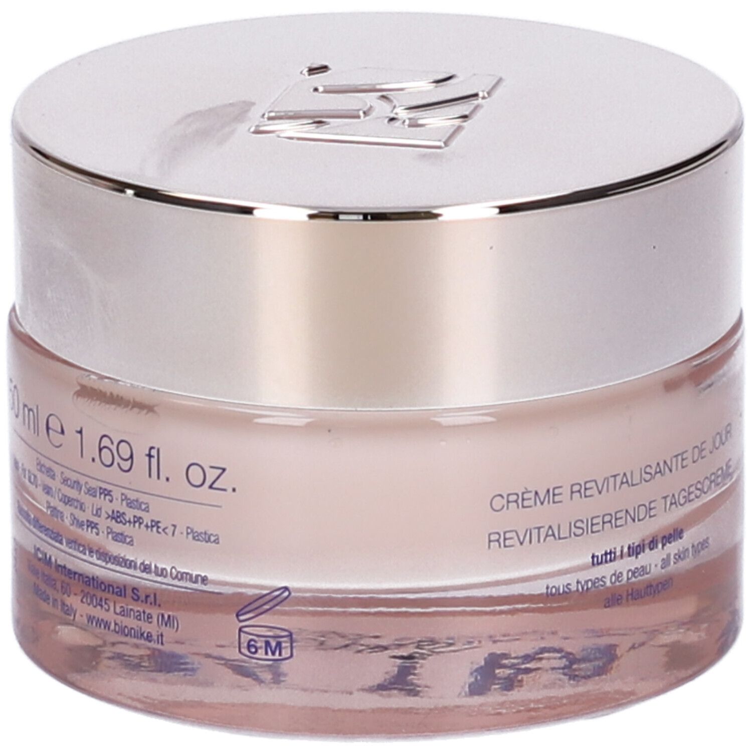 Creme-Tiegel mit silbernem Deckel. Aufschrift: 50 ml e 1.69 fl. oz. Crème revitalisante de jour, tutti i tipi di pelle, all skin types.