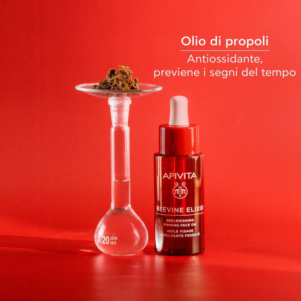 Flacone con contagocce, recipiente di vetro. Testo: Olio di propoli, Antiossidante, previene i segni del tempo.