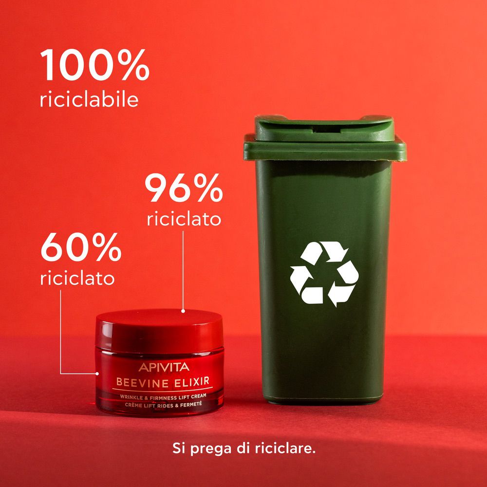 Vaso rosso APIVITA BEEVINE ELIXIR. Simbolo di riciclaggio e testo.