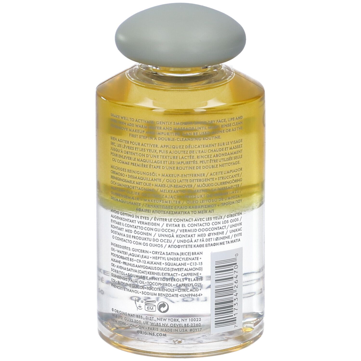 Flacone trasparente con tappo grigio. Retro con testo. Scritta: Origins Checks and Balances.