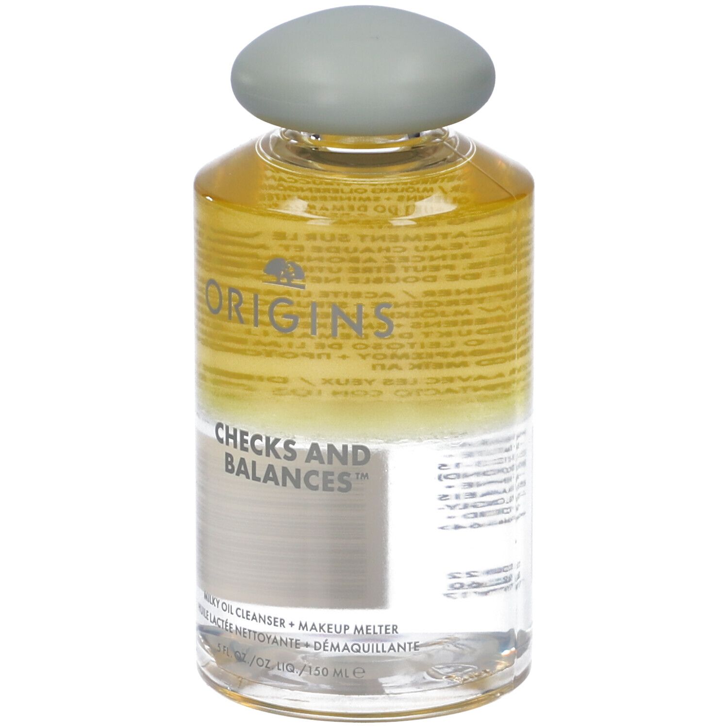Flacone trasparente con tappo grigio. Scritta: Origins Checks and Balances. Detergente olio latte.