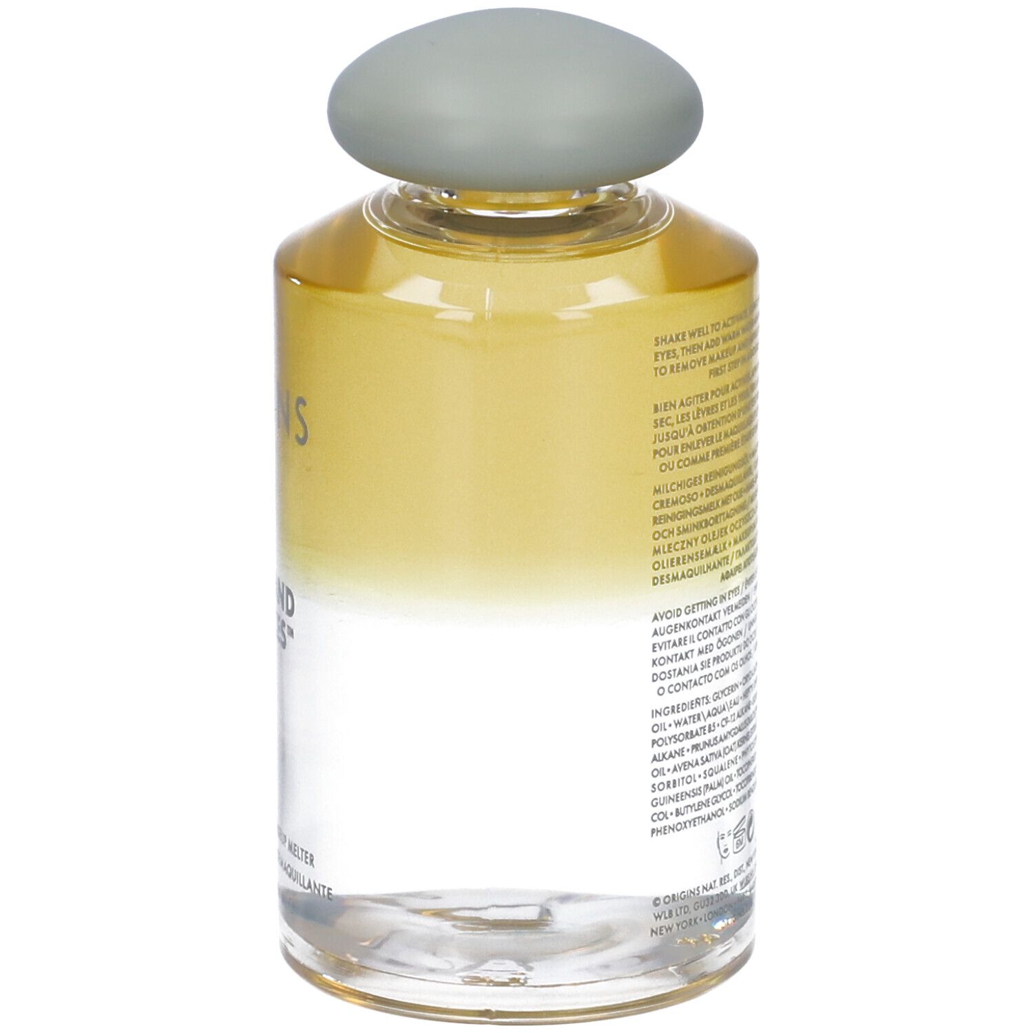 Flacone trasparente con tappo grigio. Scritta: Origins Checks and Balances. Retro con testo.