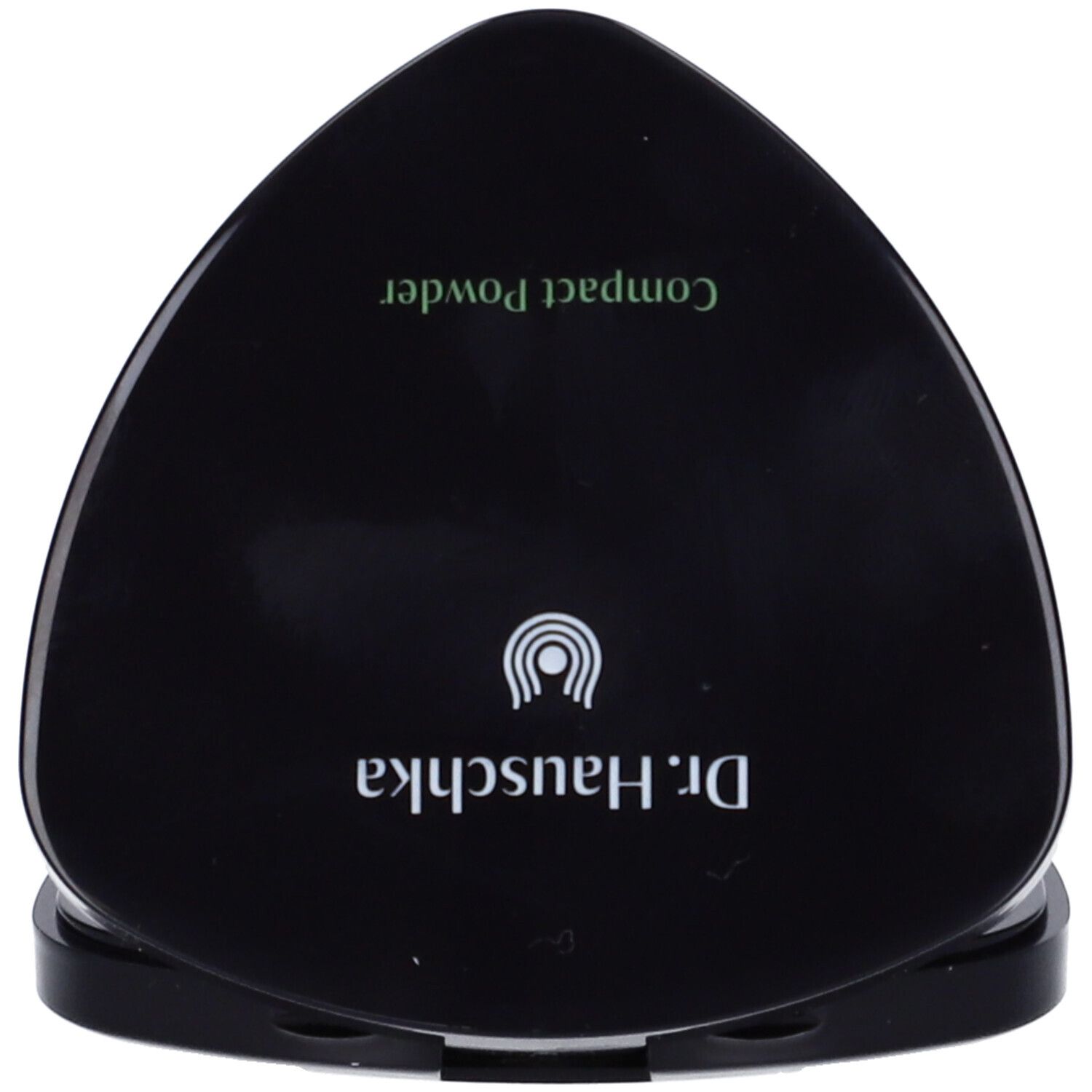 Confezione nera triangolare di cipria compatta. Scritta: Dr. Hauschka, Compact Powder.
