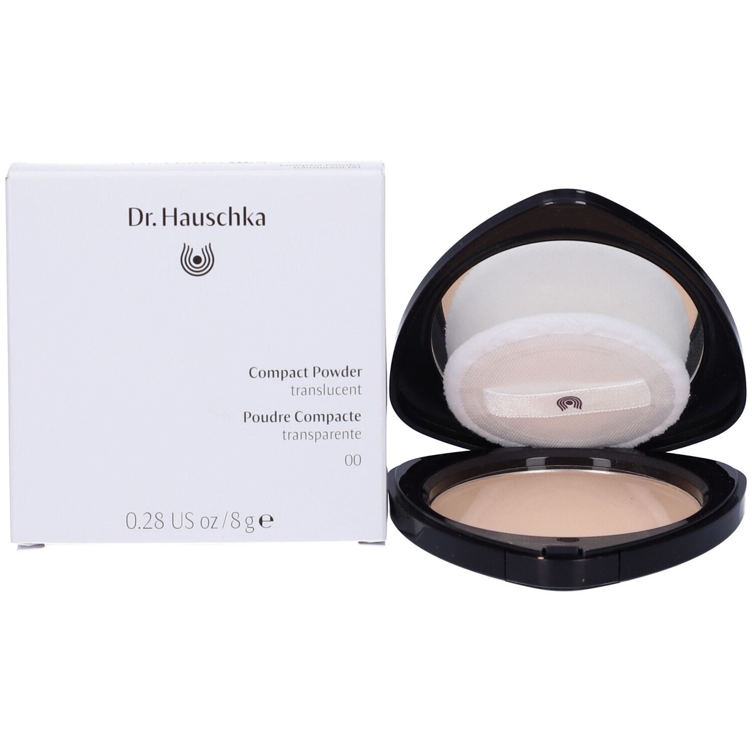 Cipria compatta con confezione. Confezione e astuccio mostrano Dr. Hauschka. Cipria trasparente.