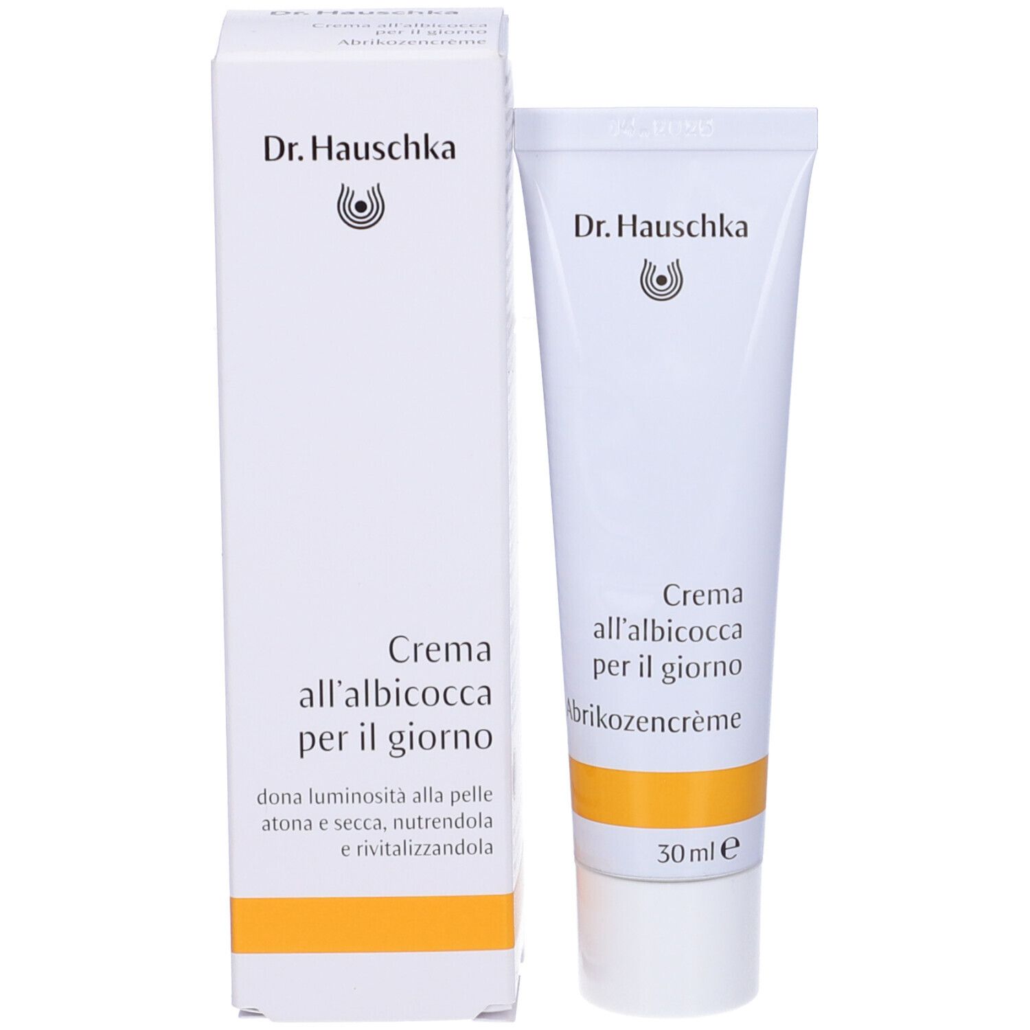 Confezione del prodotto. Scatola e tubo bianchi. Scritta: Dr. Hauschka, Crema all'albicocca per il giorno, 30 ml.