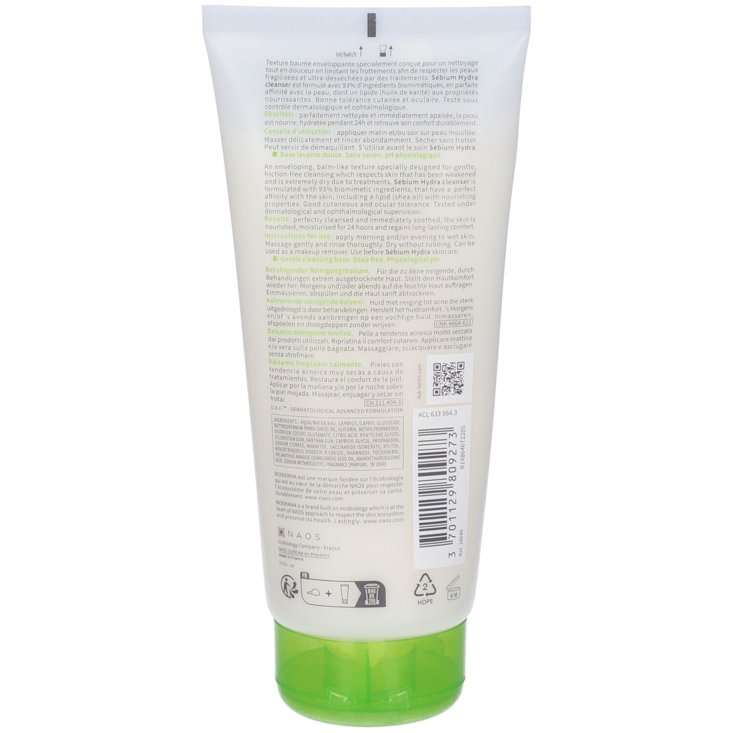 Retro del tubo. Testo multilingue. Tappo verde. Codice a barre e altri simboli.