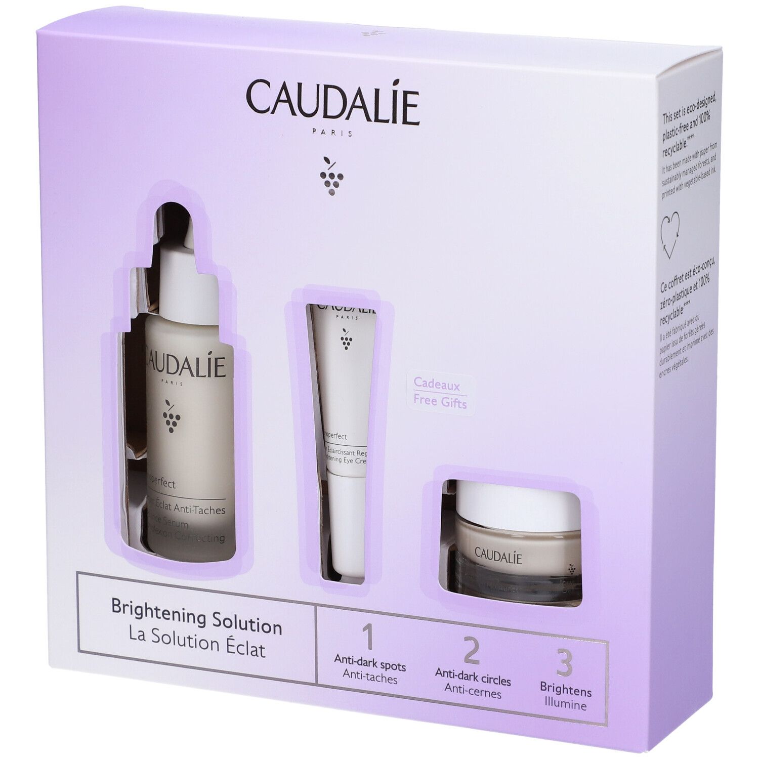 Confezione CAUDALIE bianca e viola. Contiene siero, crema occhi e crema. Testo: Brightening Solution. Confezione regalo.