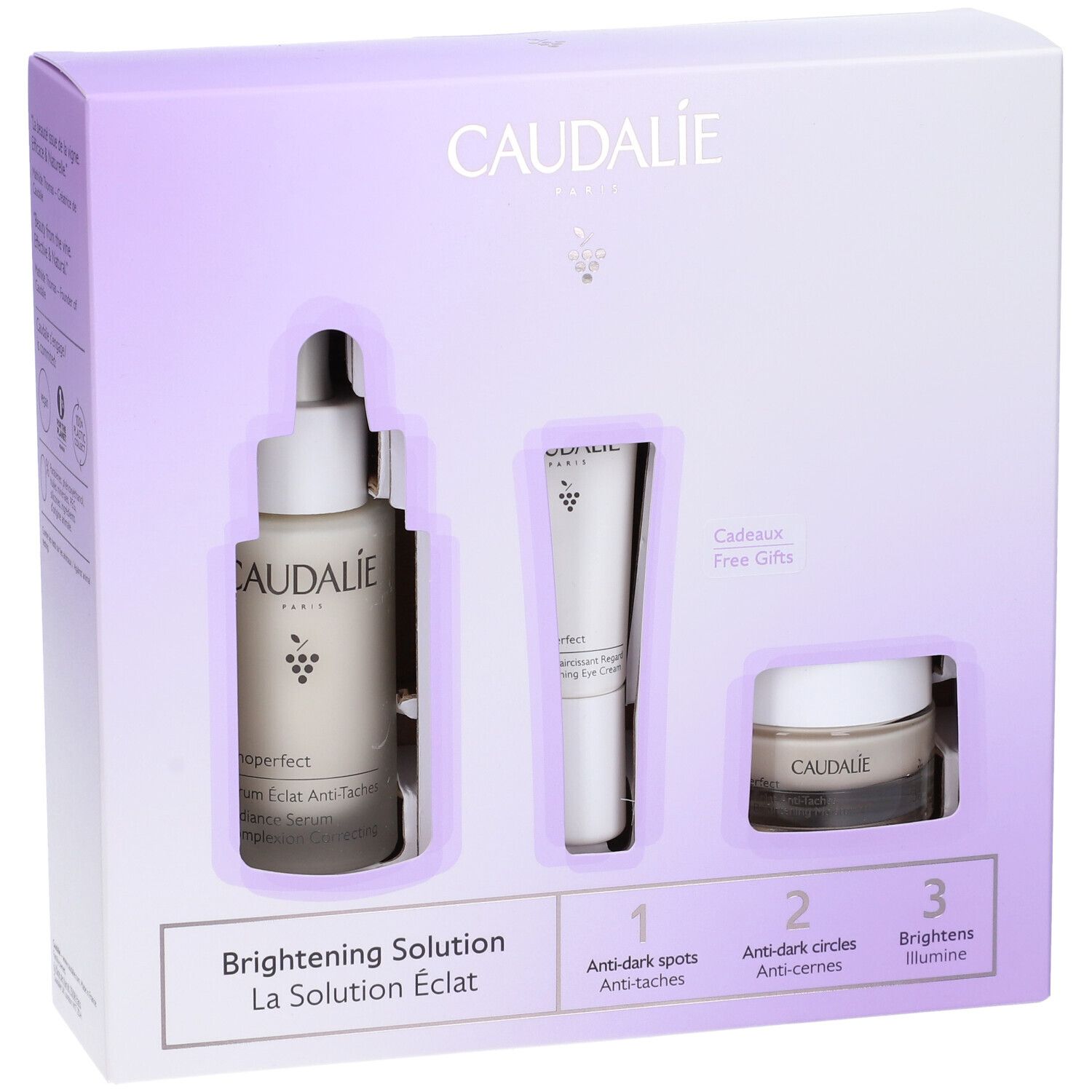 Confezione CAUDALIE bianca e viola. Contiene siero, crema occhi e crema. Testo: Brightening Solution. Confezione regalo.