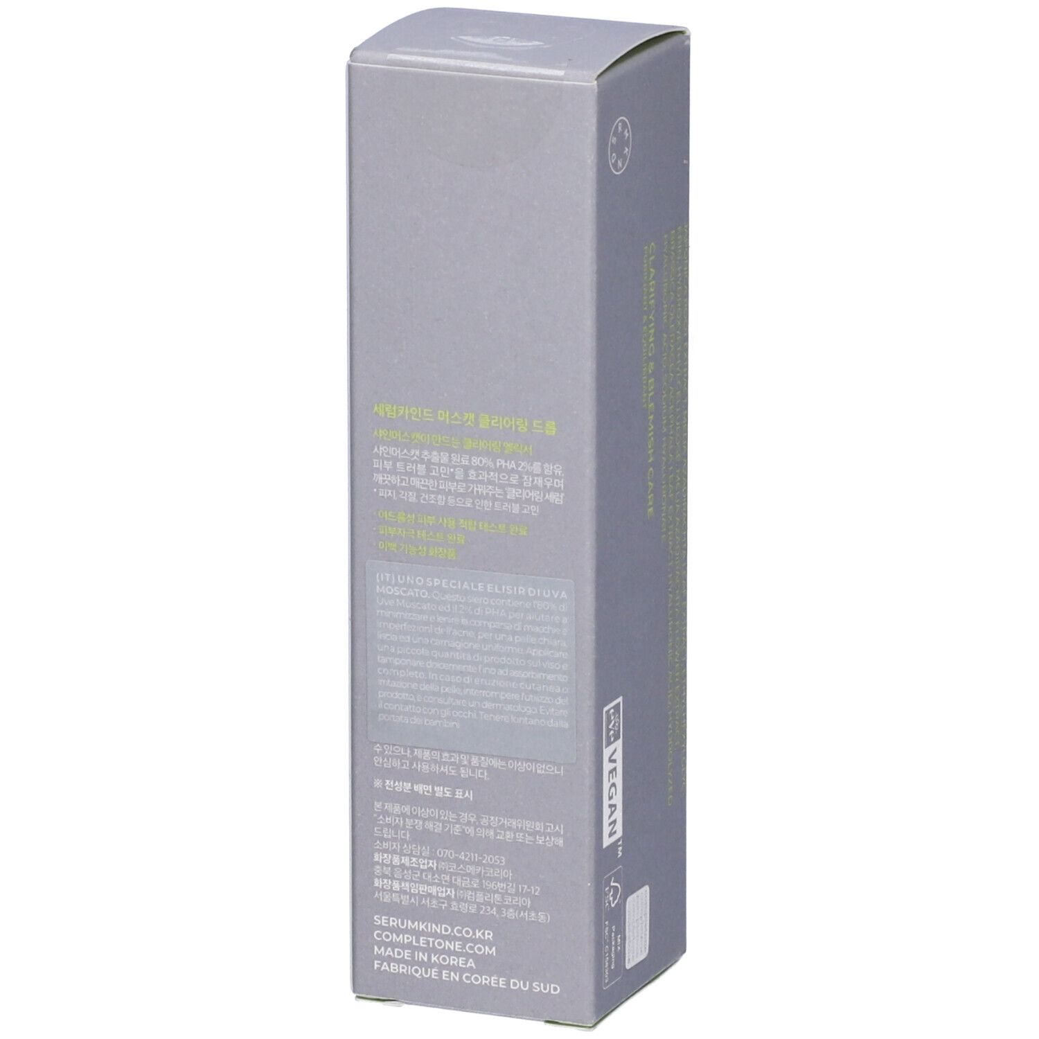 Confezione grigia. Testo multilingue. Sigillo vegano. Indirizzo del produttore.
