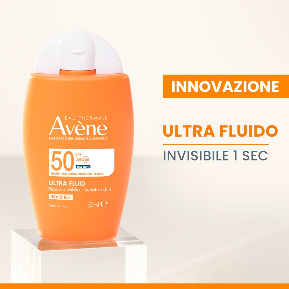 Flacone arancione con tappo bianco. Testo: Ultra Fluid Invisible 1 secondo.